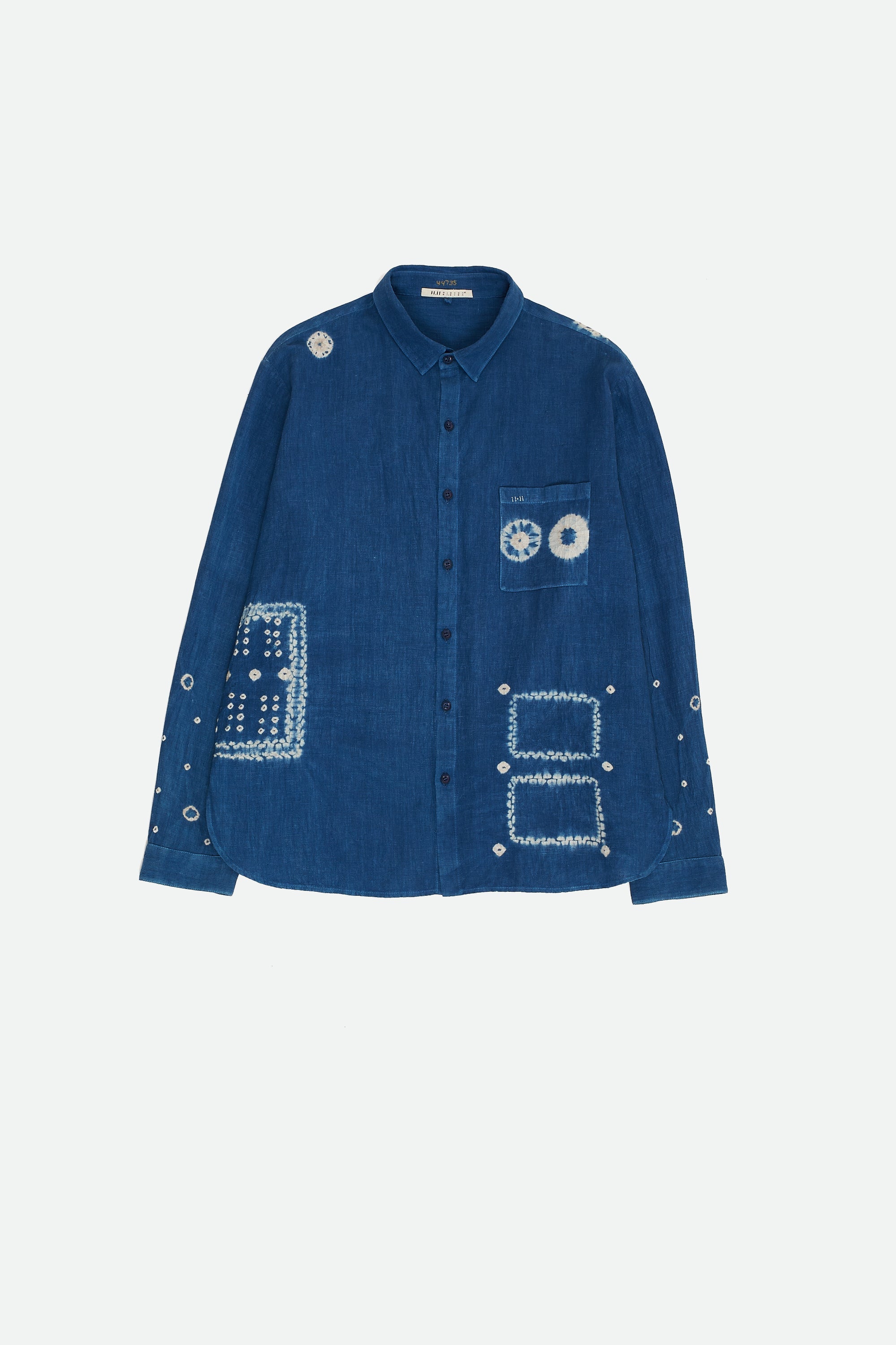 Front image of a medium indigo shirt with shibori work