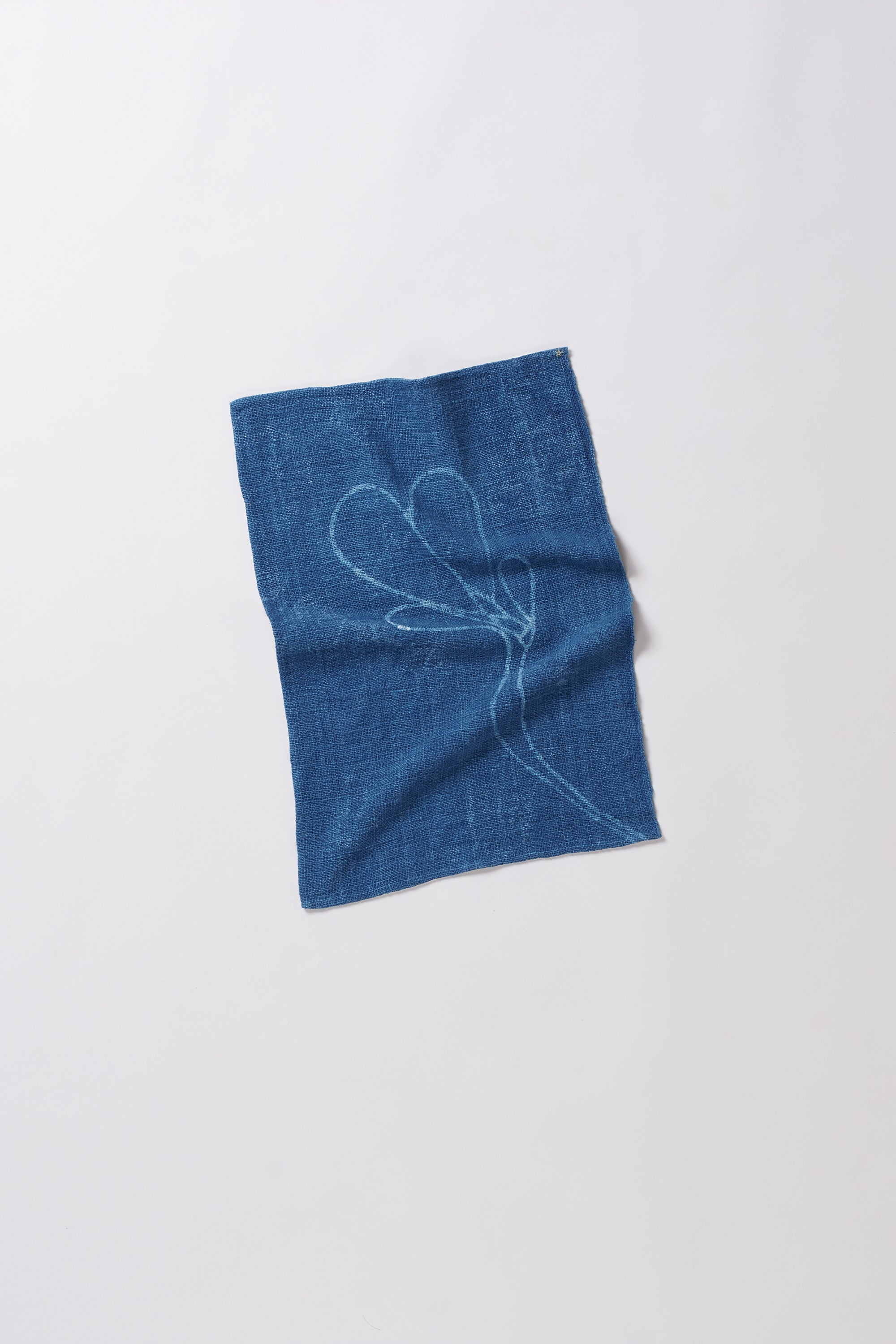 Blue fabric with a white embroidered design