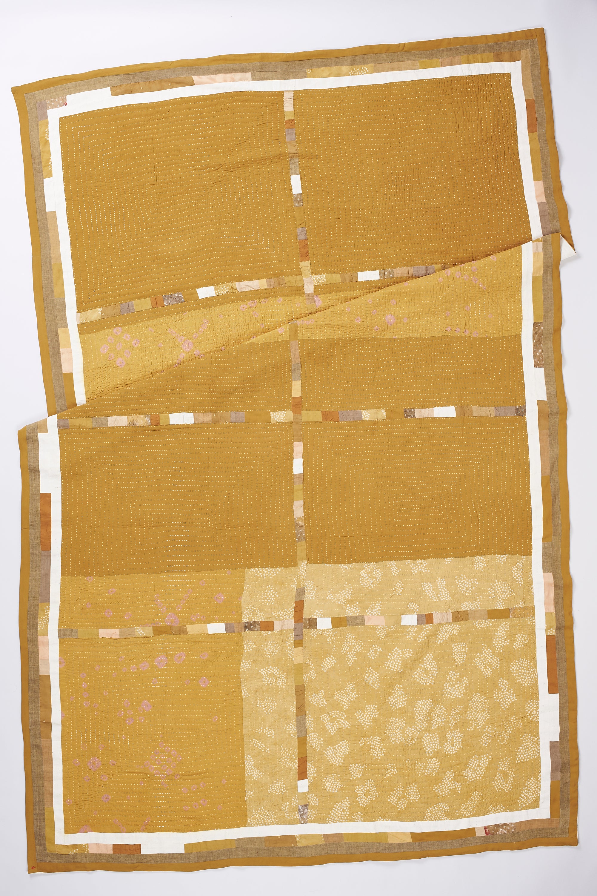 Ochere yellow quilt with kantha work