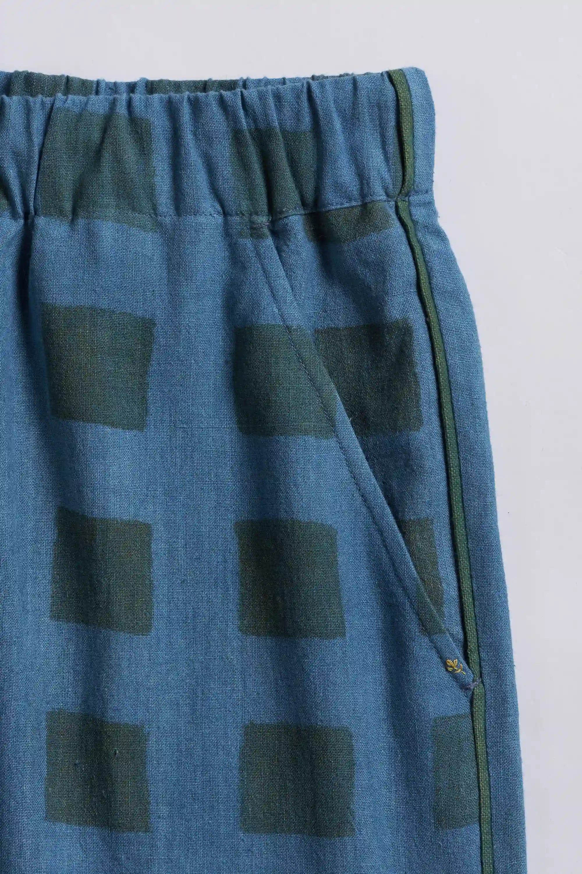 Blue checkered pants with pocket on a white background