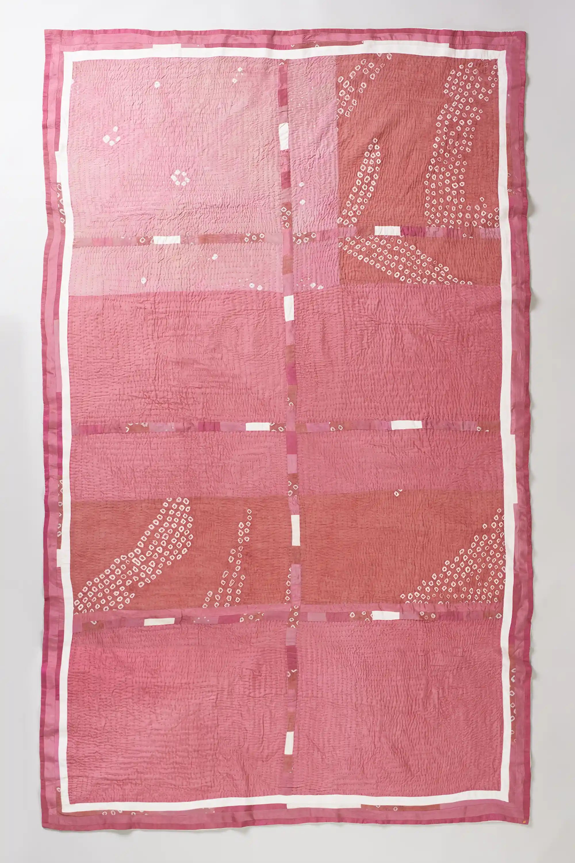 Light pink patchwork quilt