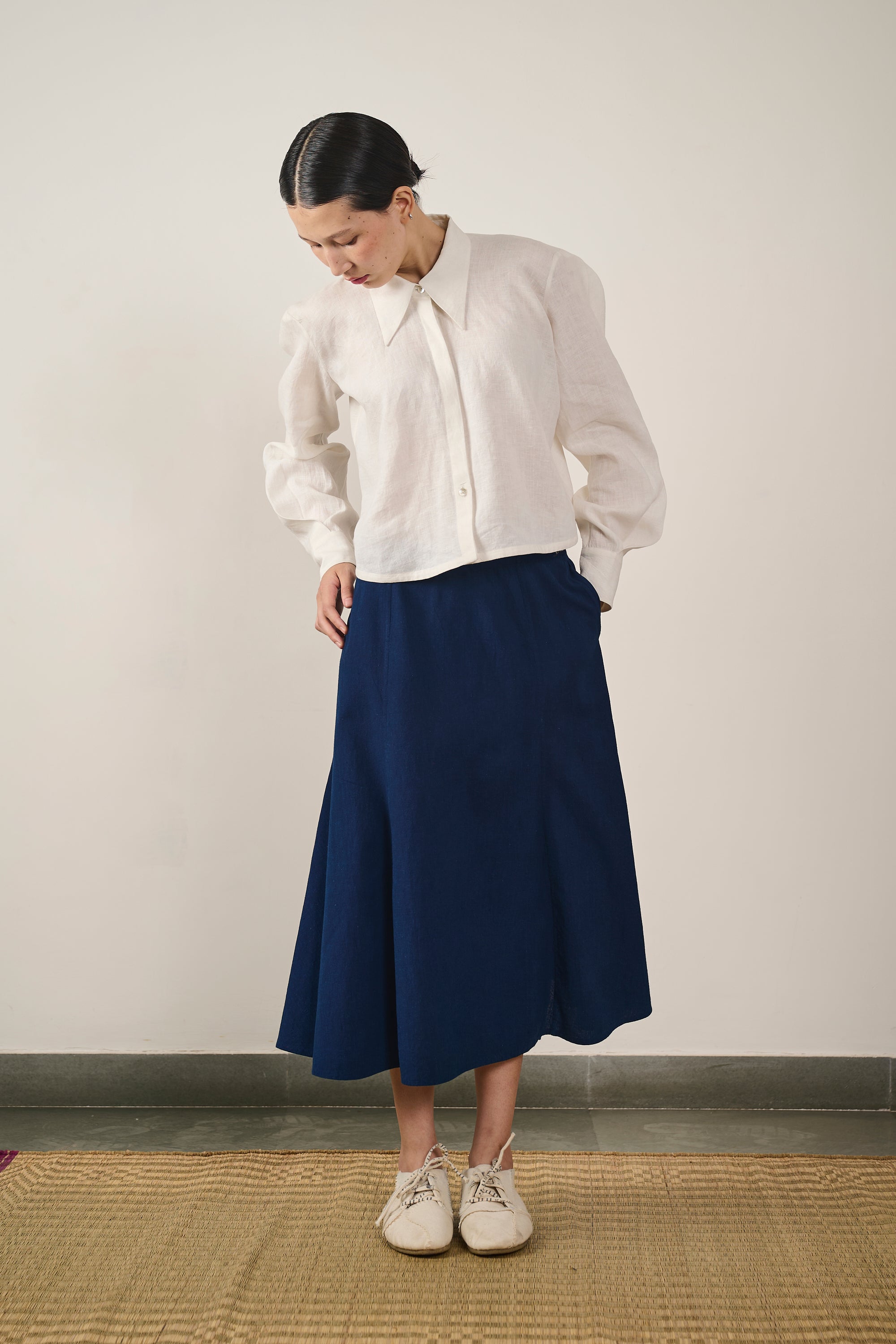 A woman wearing indigo skirt