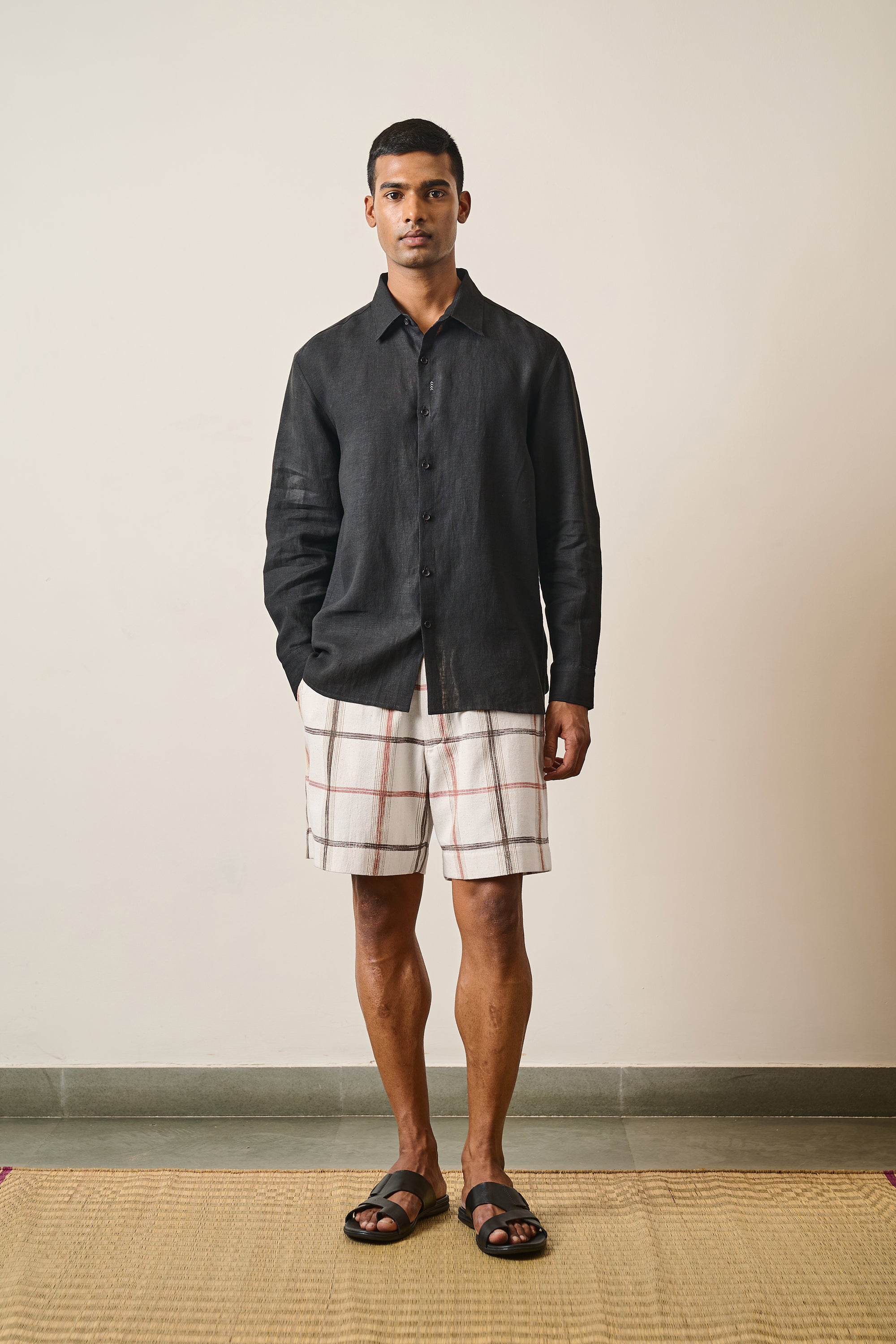 A man wearing black linen shirt