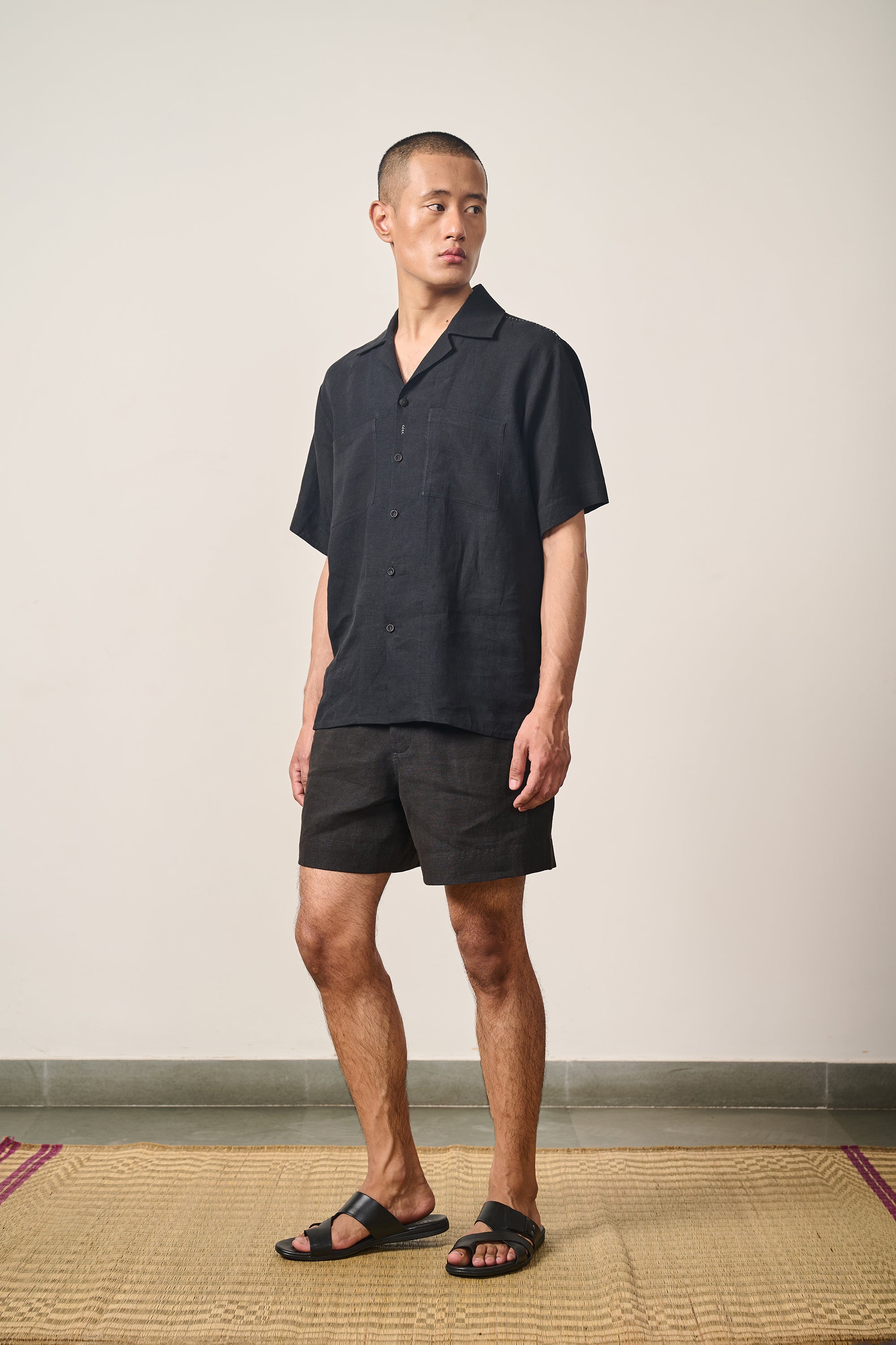 A man wearing linen black shirt