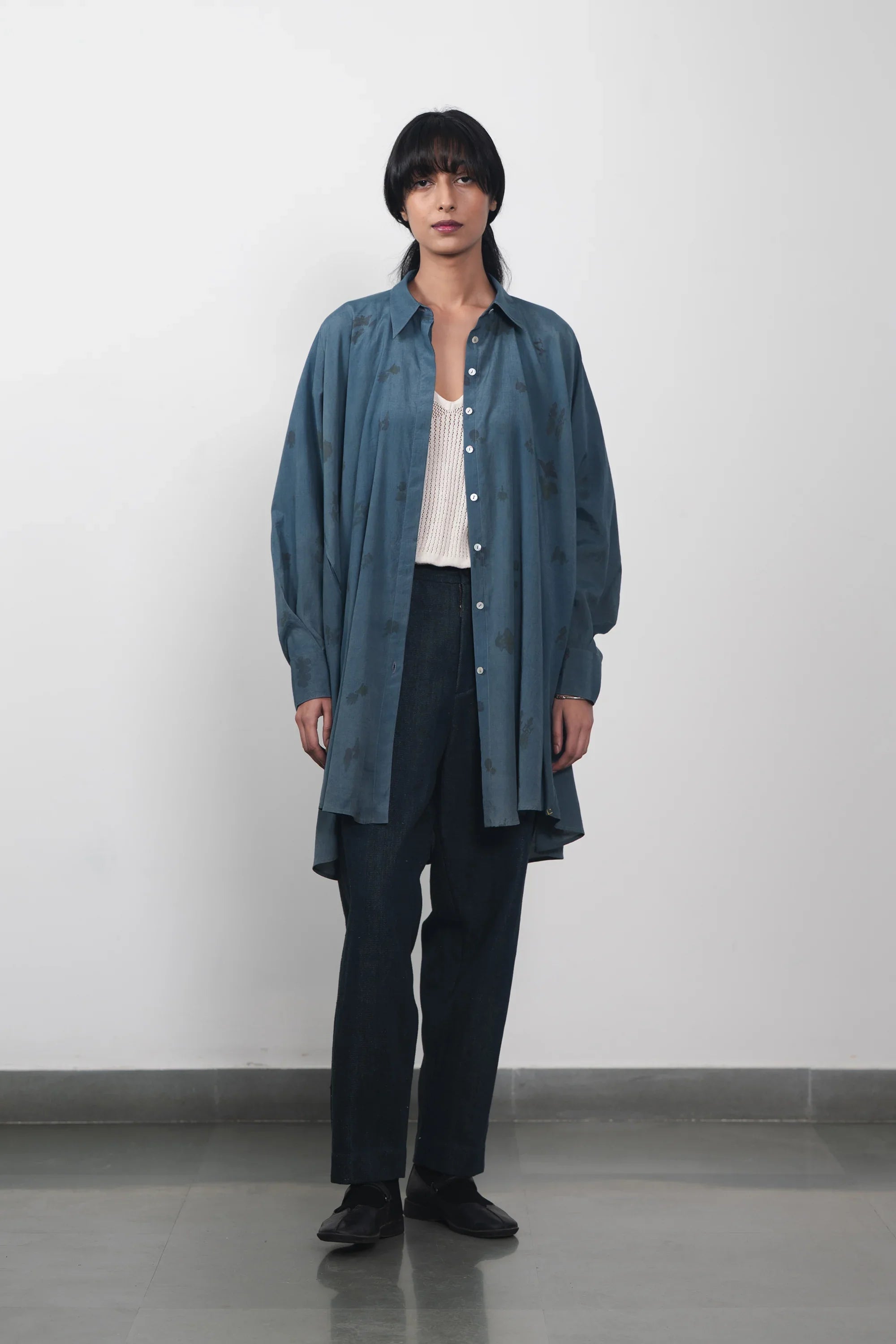 A women wearing estate blue shirt