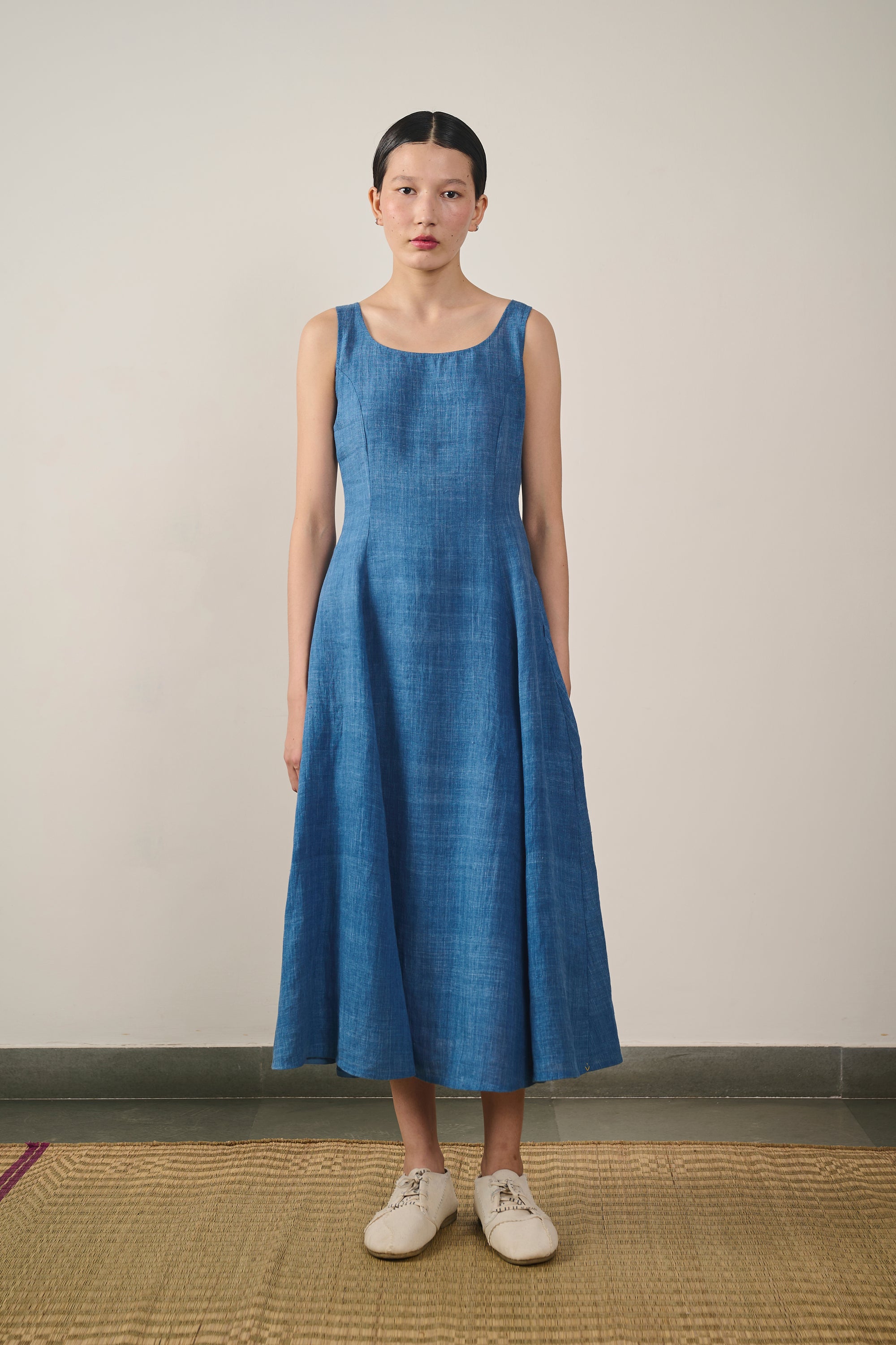 A woman wearing medium indigo dress