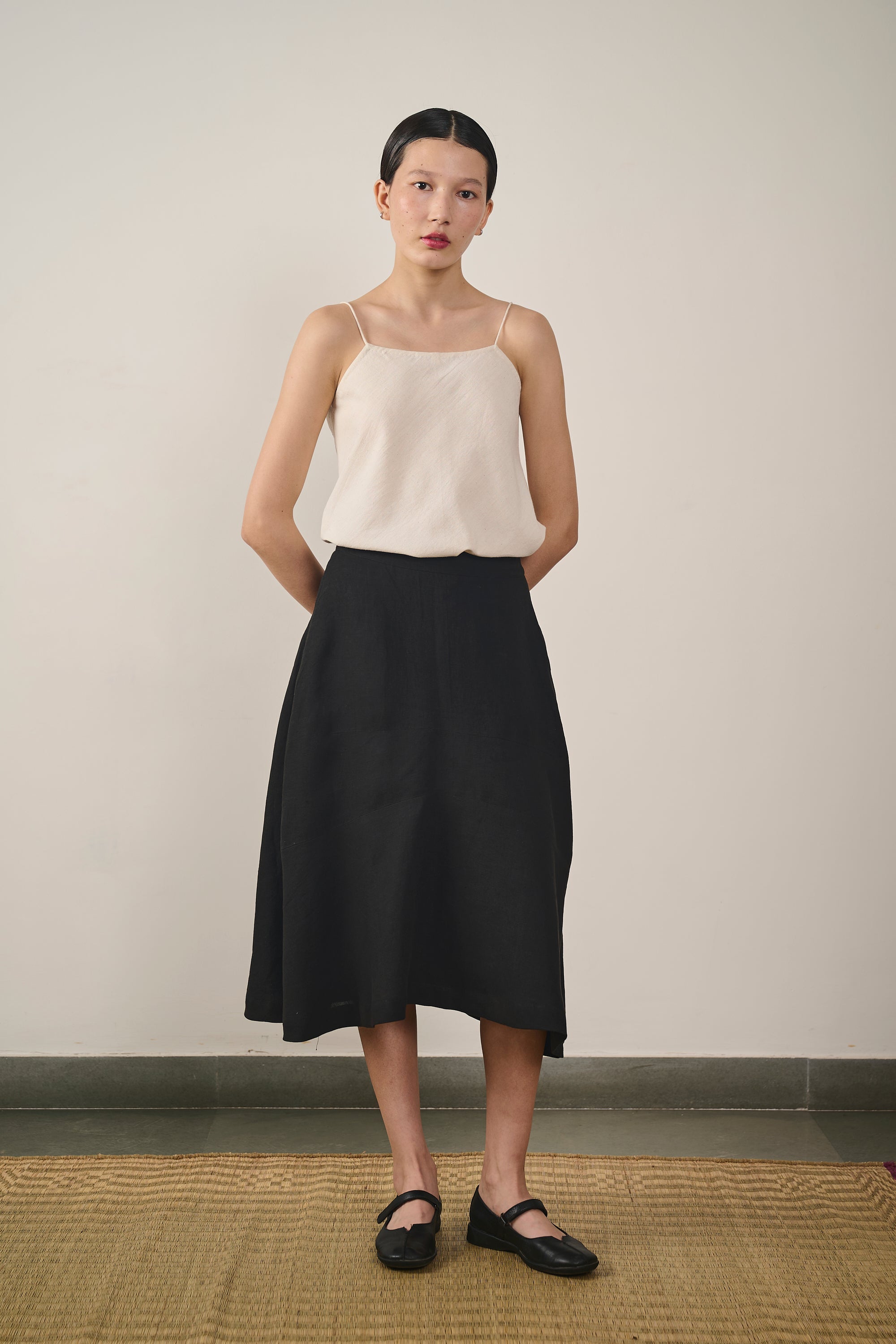 A woman wearing linen skirt