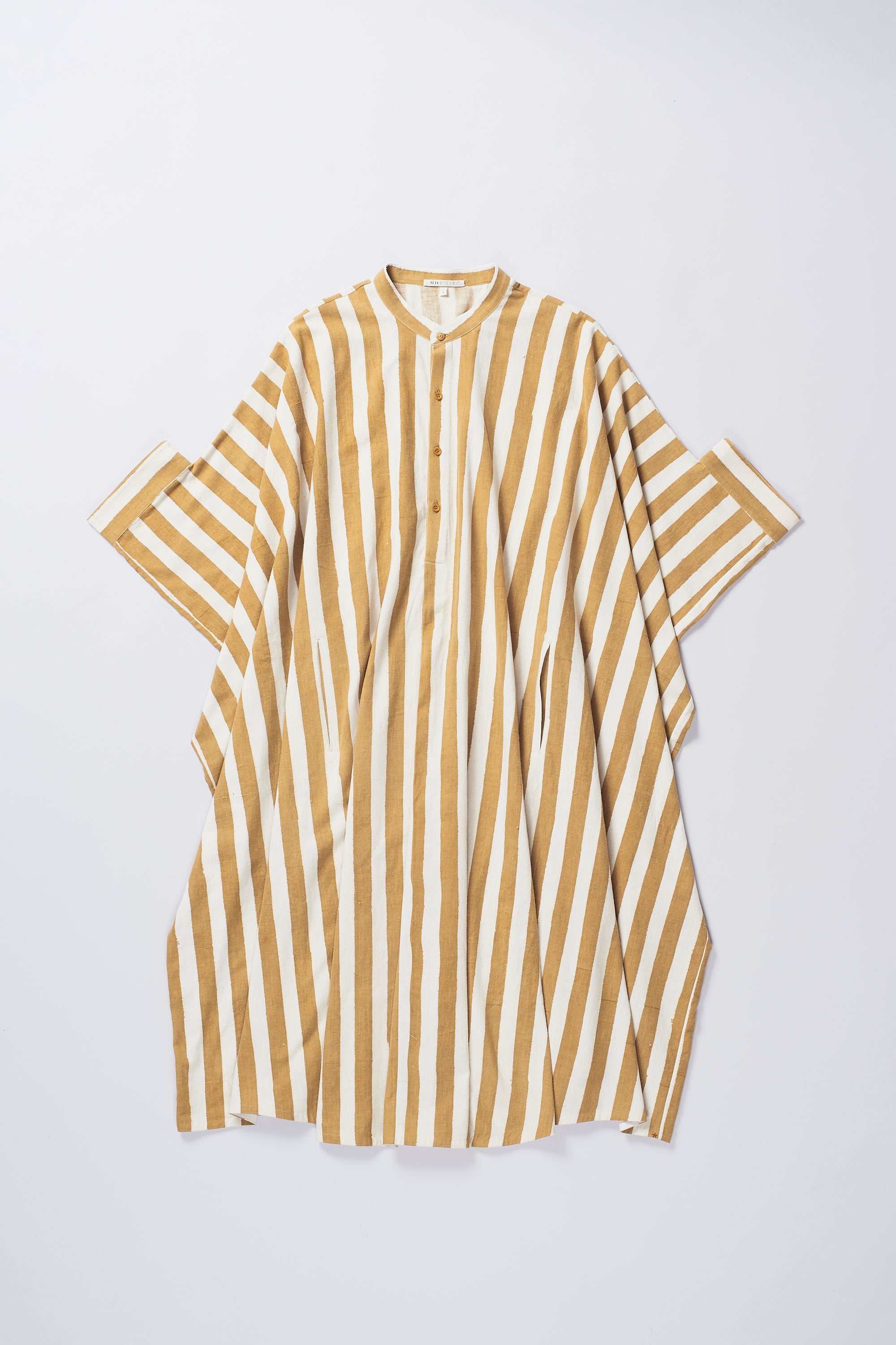 Front image of a mustard yellow kaftan