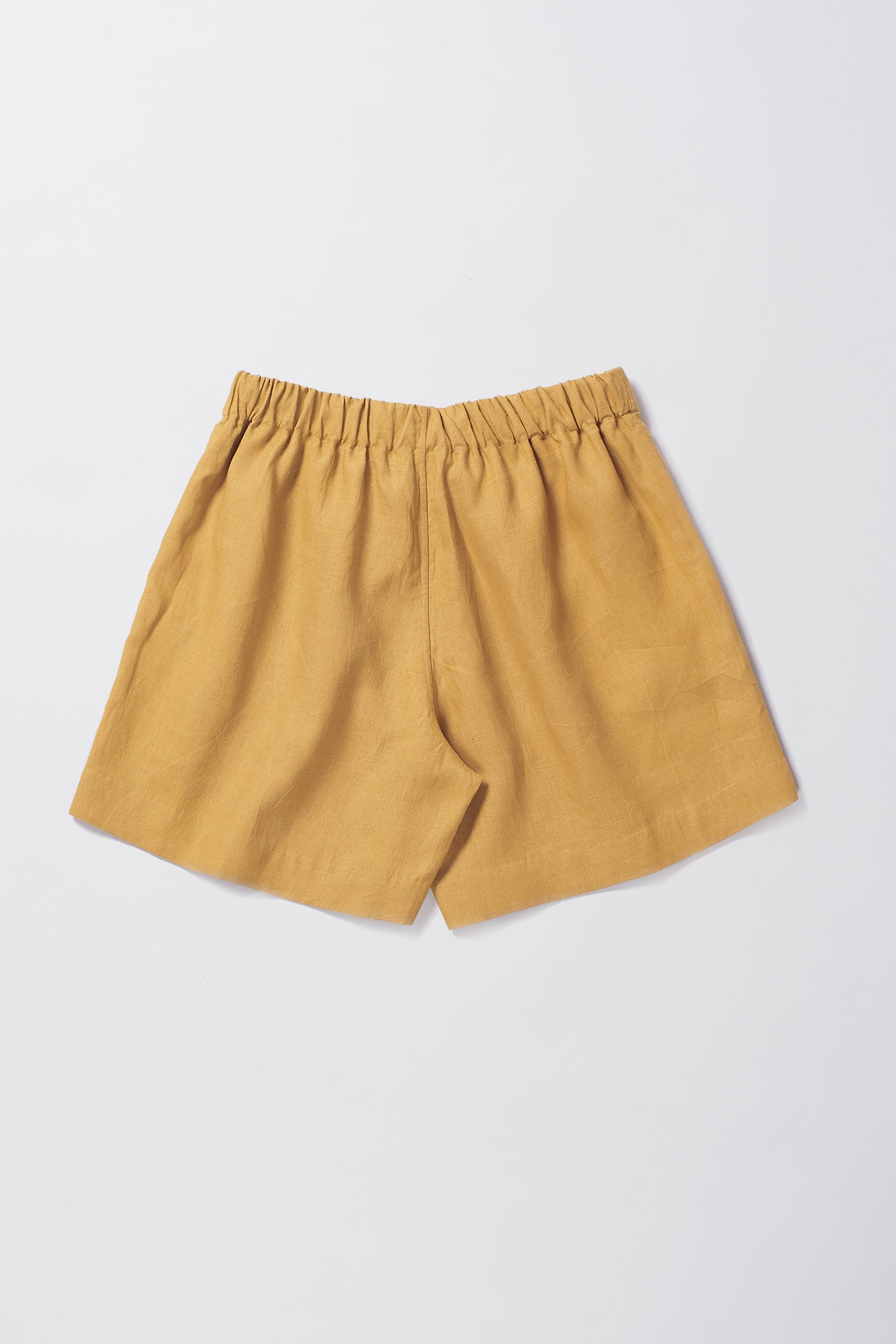 Back image of mustard yellow shorts