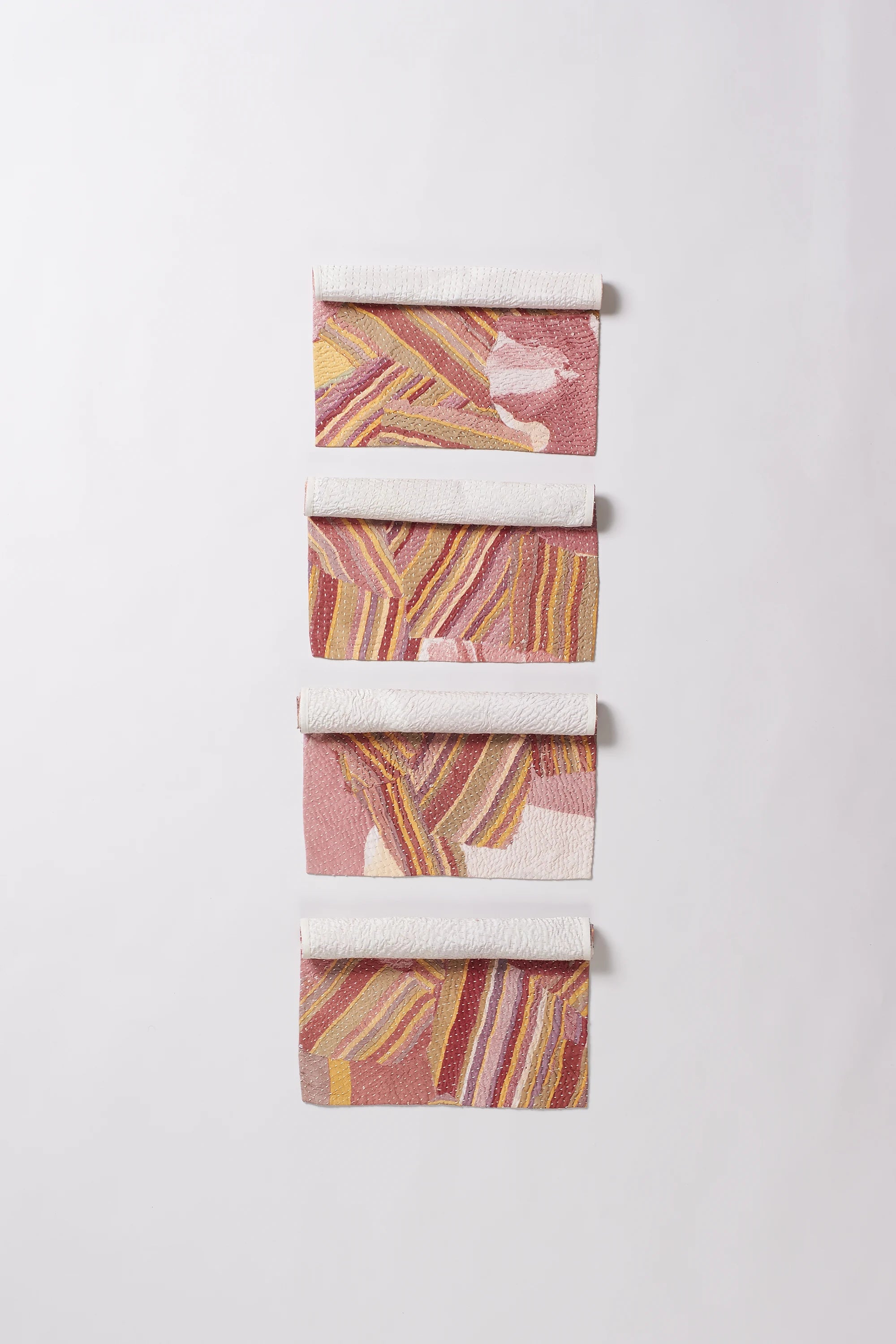 Colorful patterned fabric roll on a white background