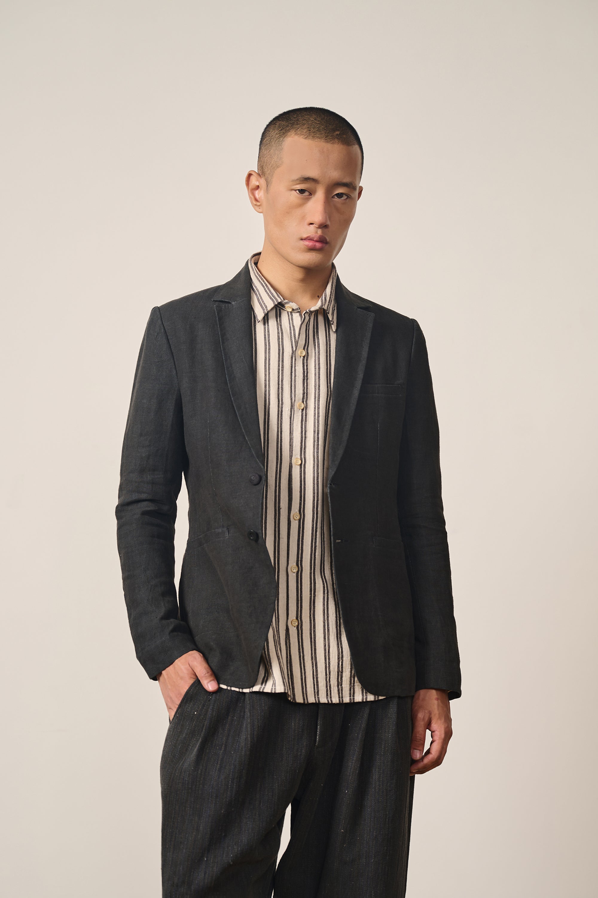 A man wearing black linen jacket