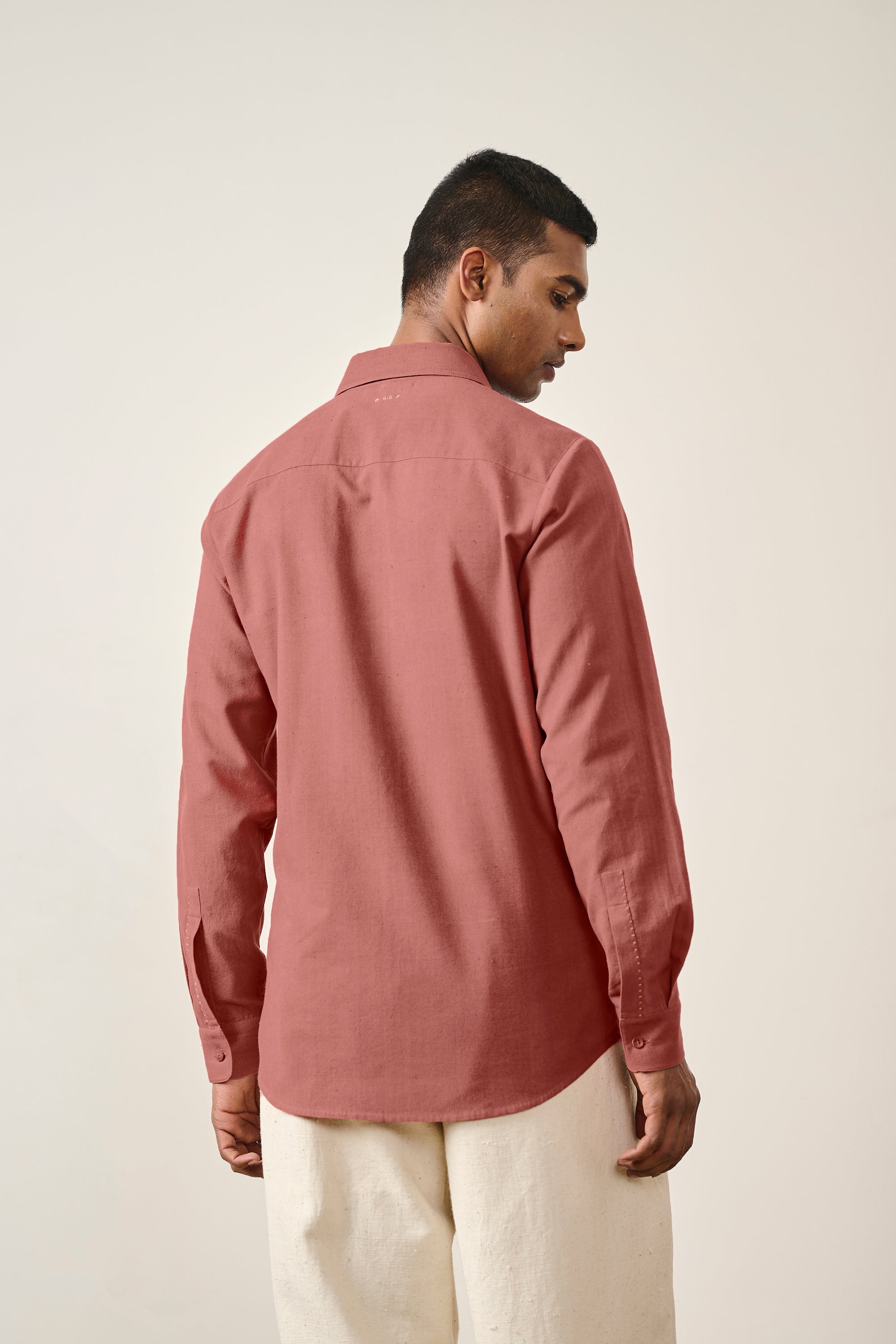 A back shot of a rouge pink shirt