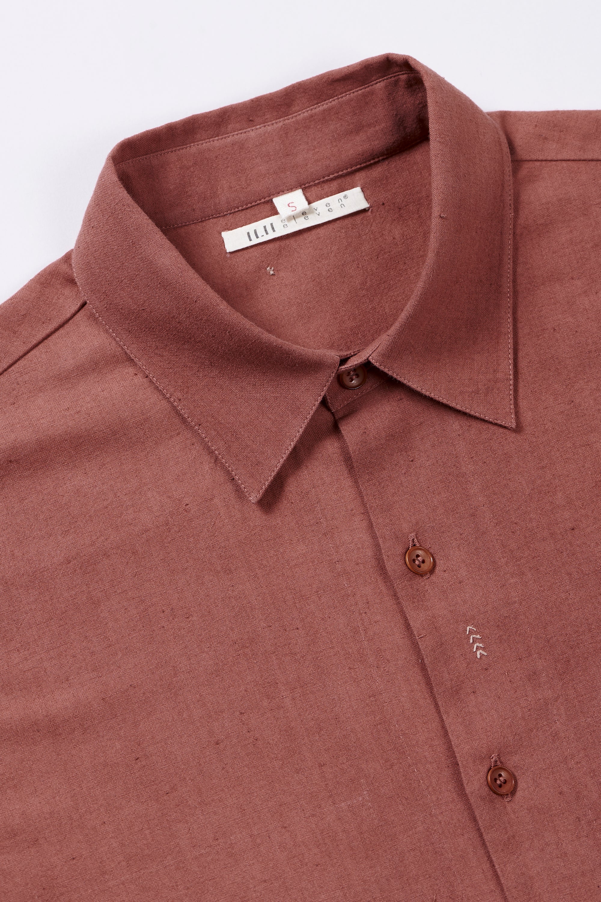 Fabric close- up with buttons and collar