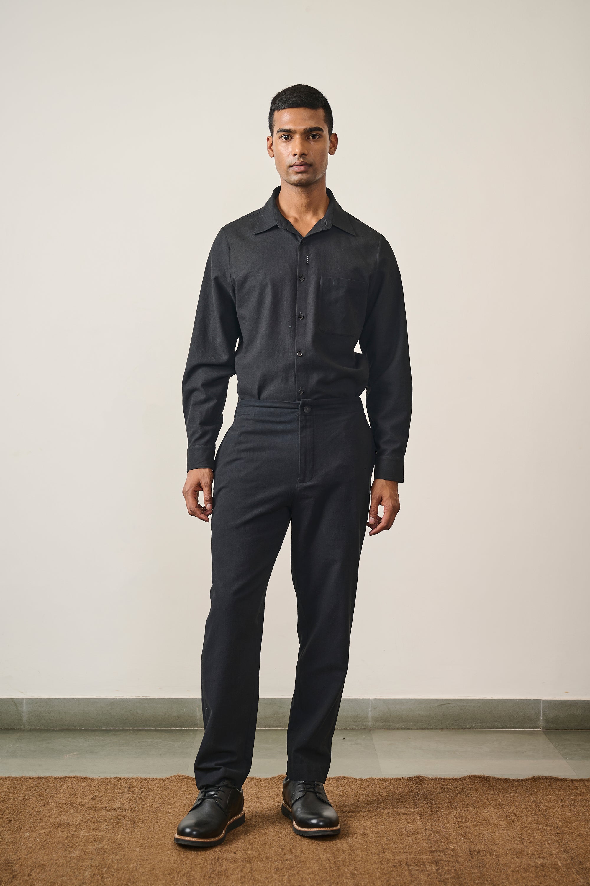 A man wearing cotton black shirt