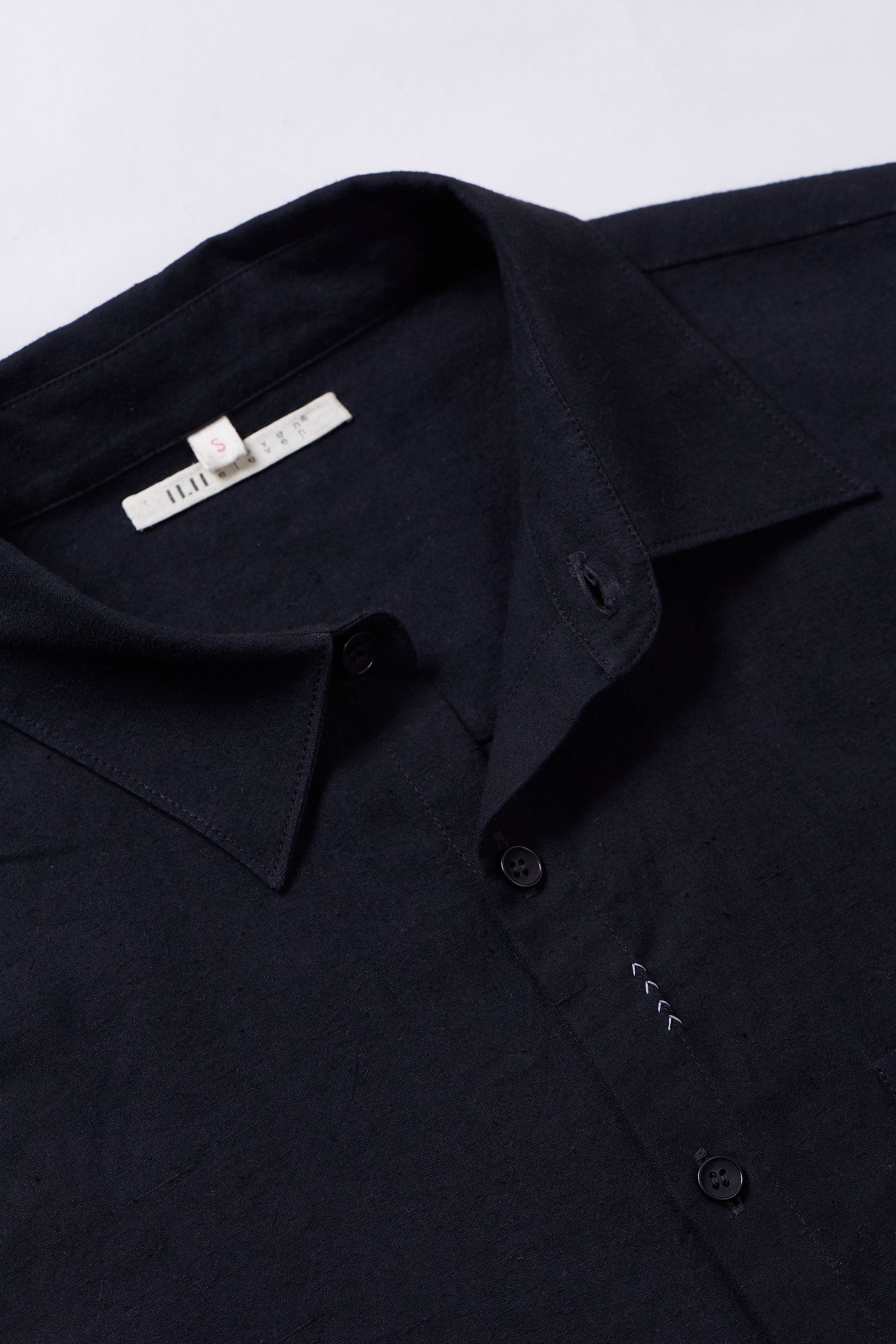 Fabric close- up with buttons and collar