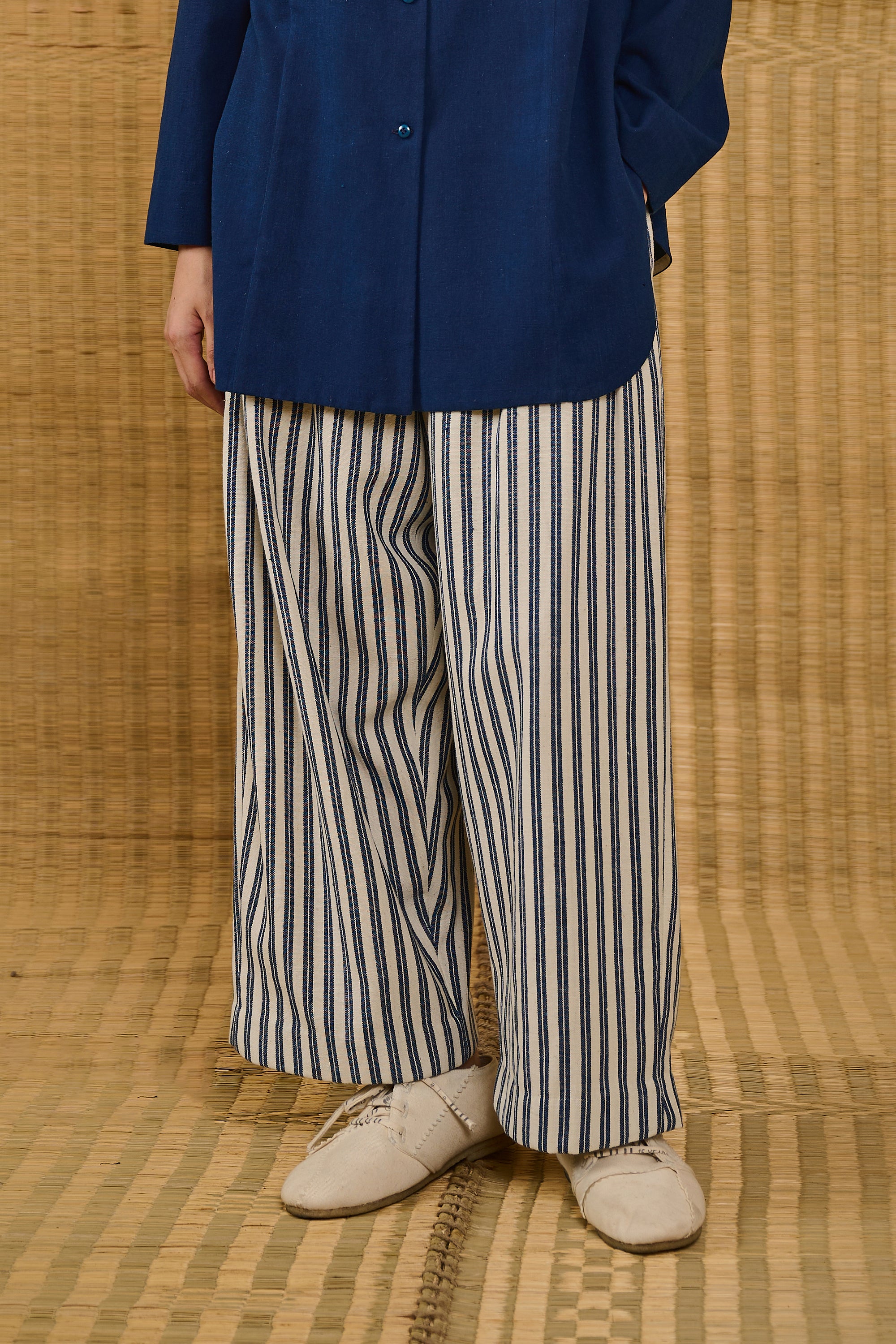 A woman wearing medium indigo cotton pant