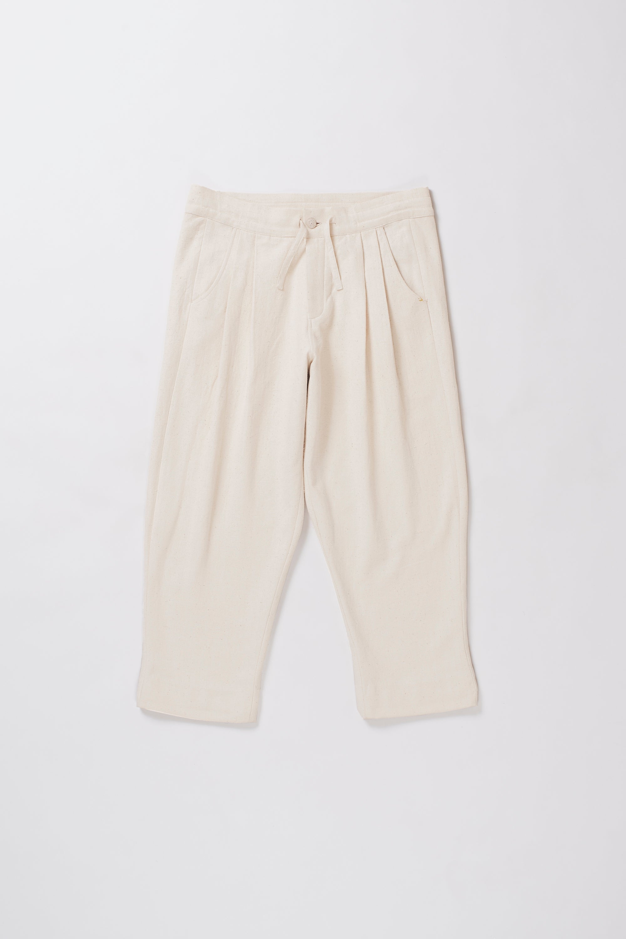 Ecru pants on a light grey background