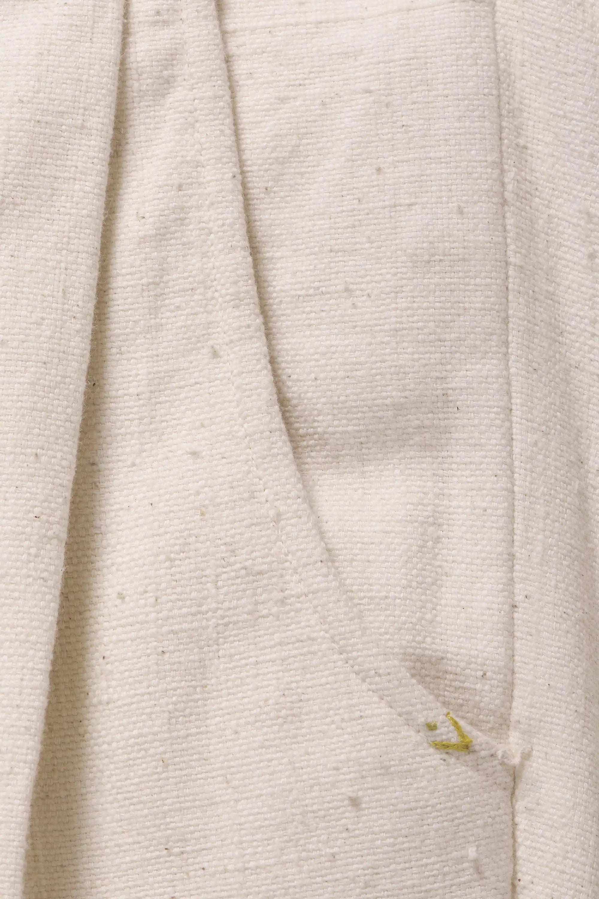 Fabric close-up with pocket and small yellow pehchan