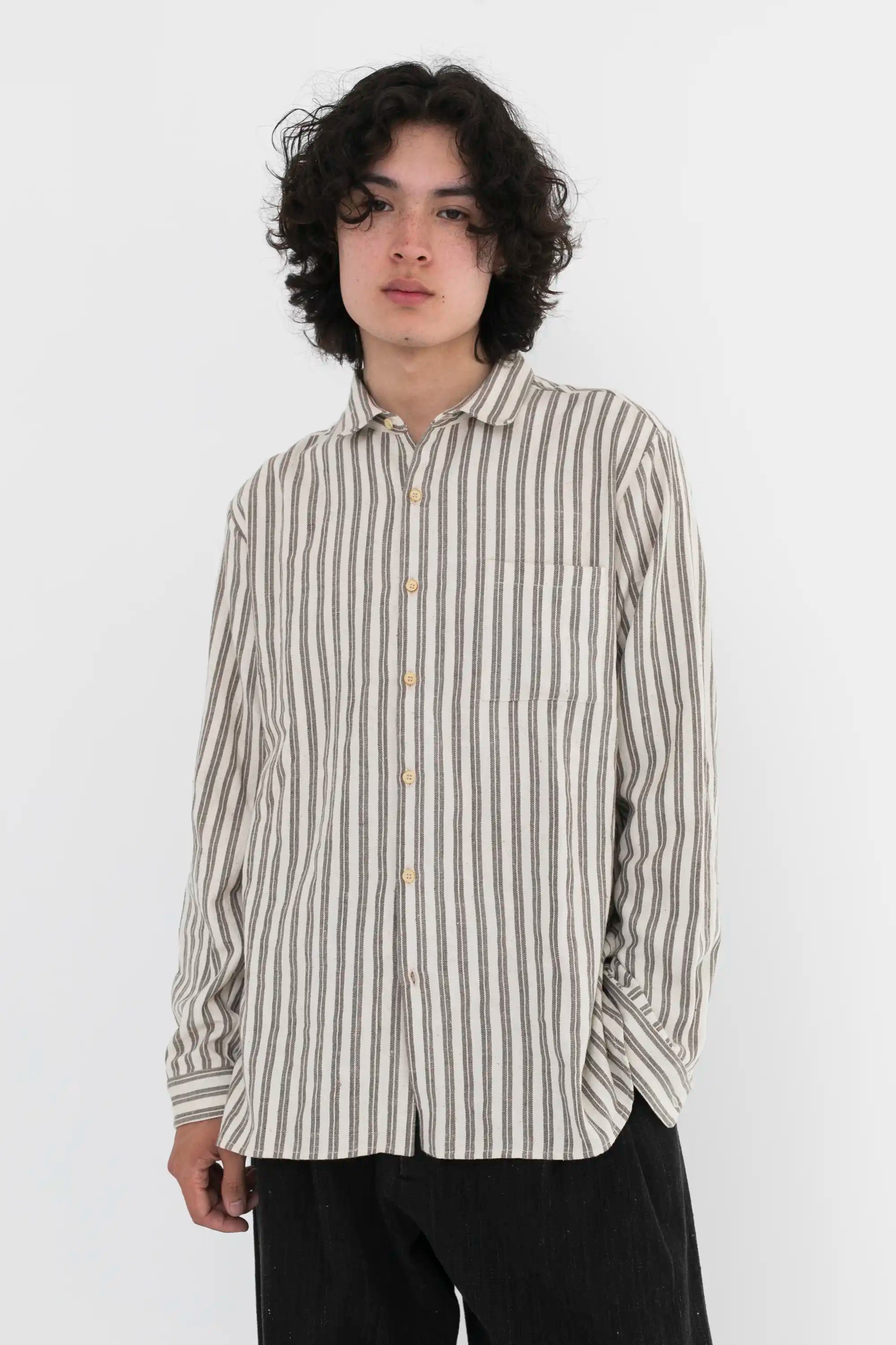 A man wearing charcoal cotton shirt