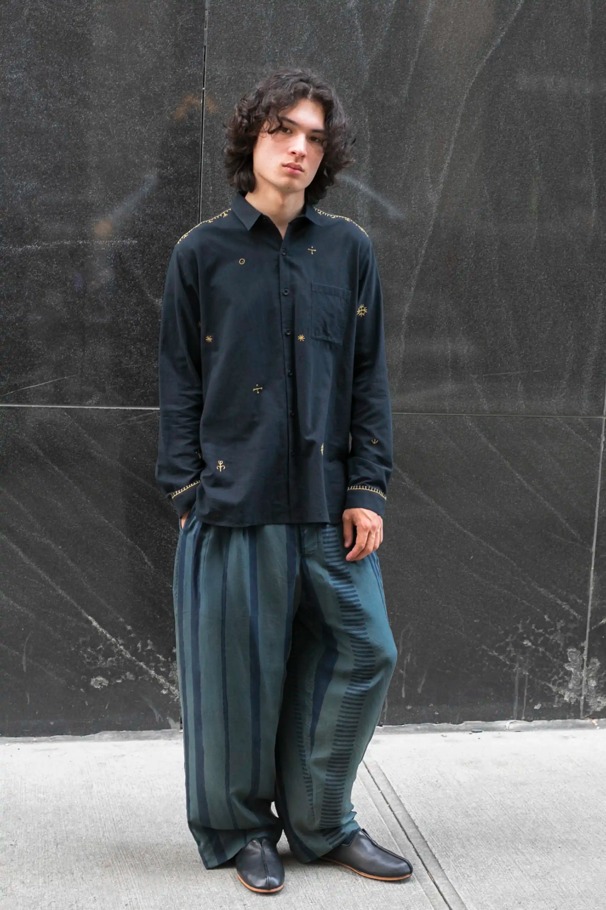 A man wearing midnight indigo shirt