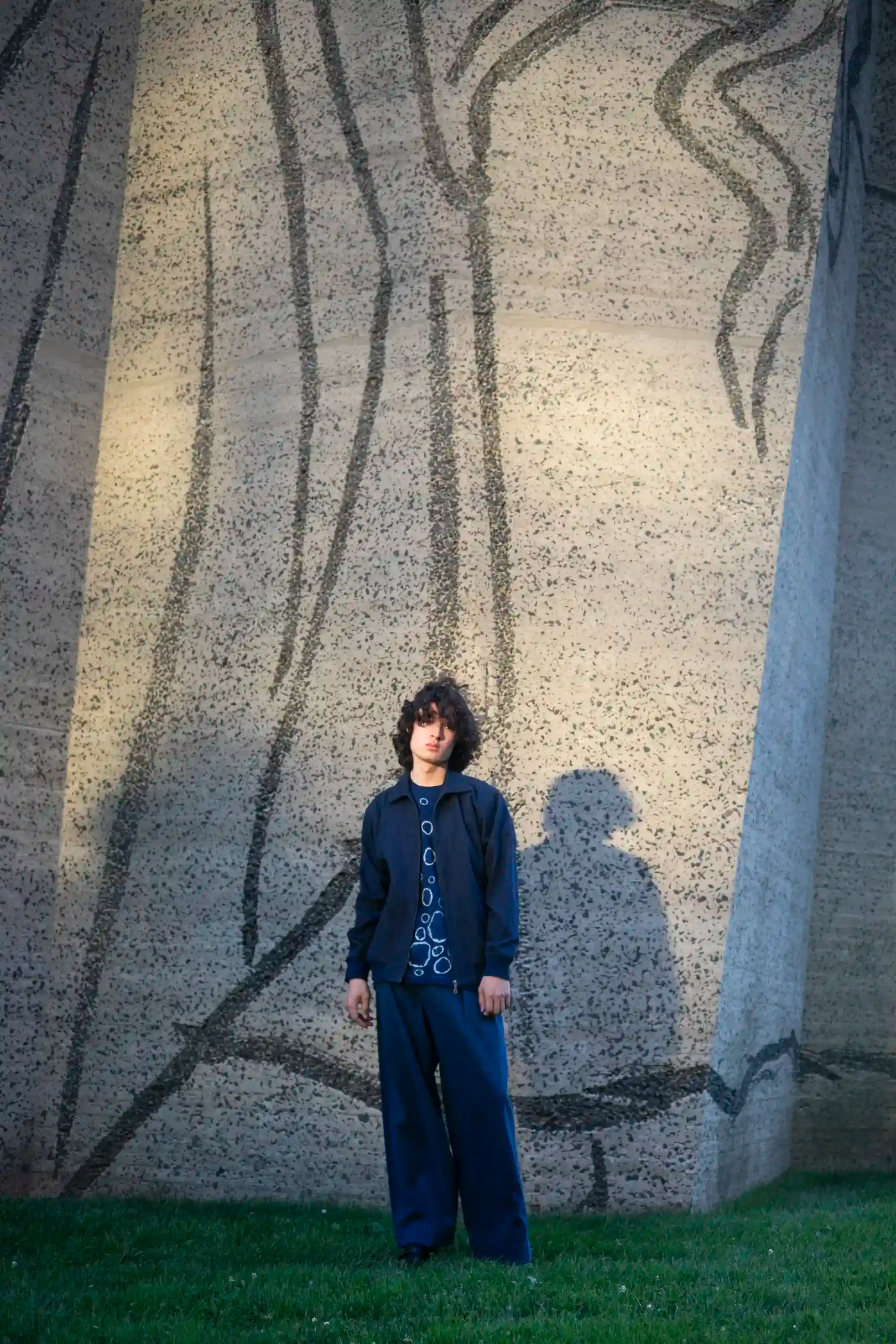 A man wearing indigo denim jacket