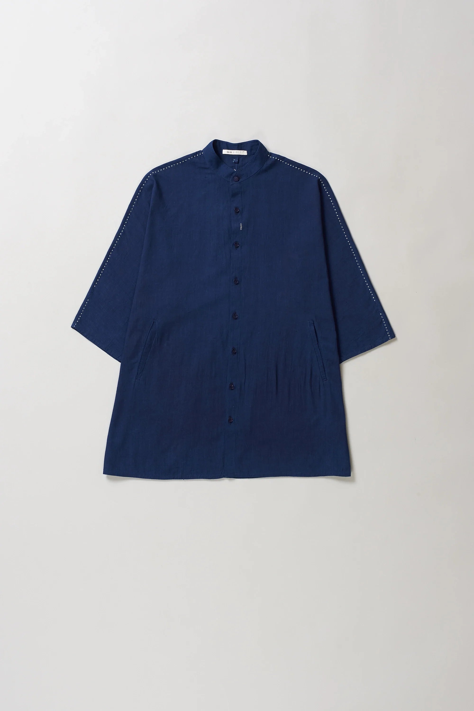 Blue shirt on a light grey background