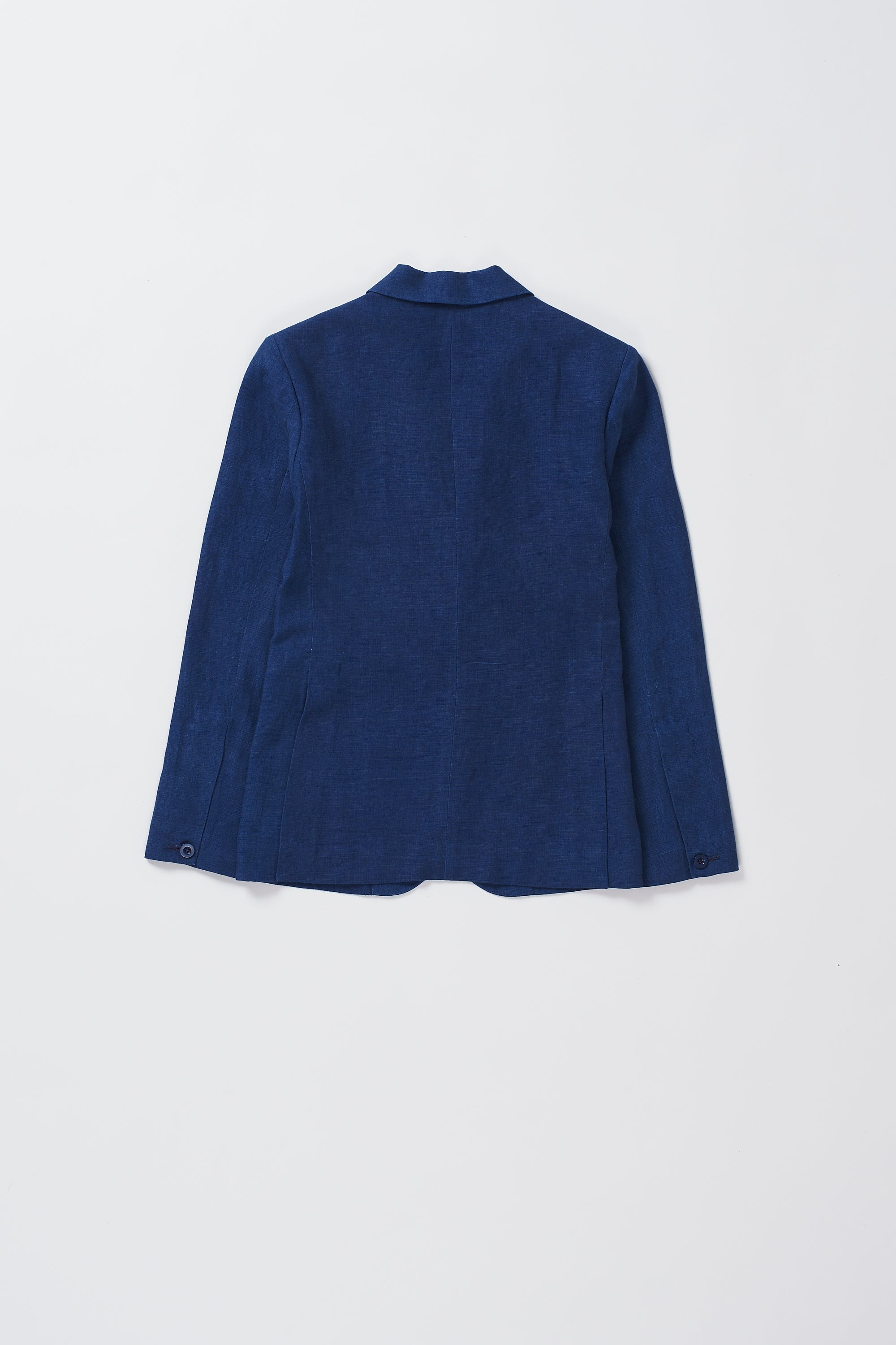 A back shot of a man wearing indigo jacket