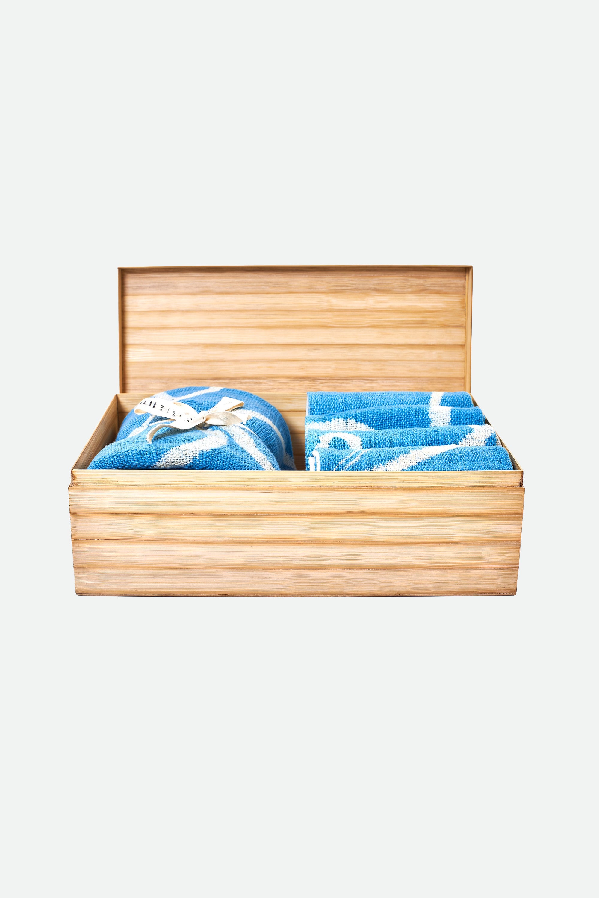 Open wooden box with indigo towel