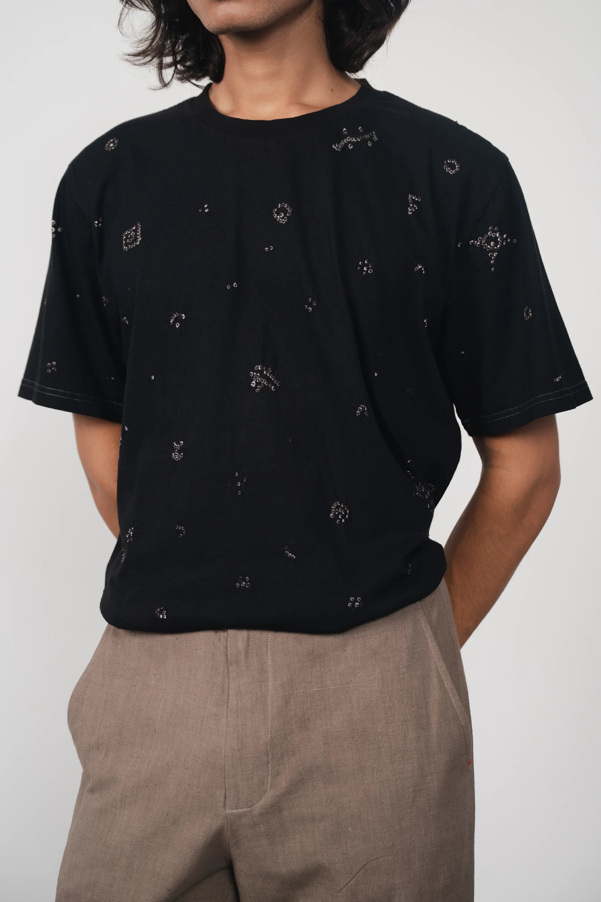 A man wearing black cotton t-shirt