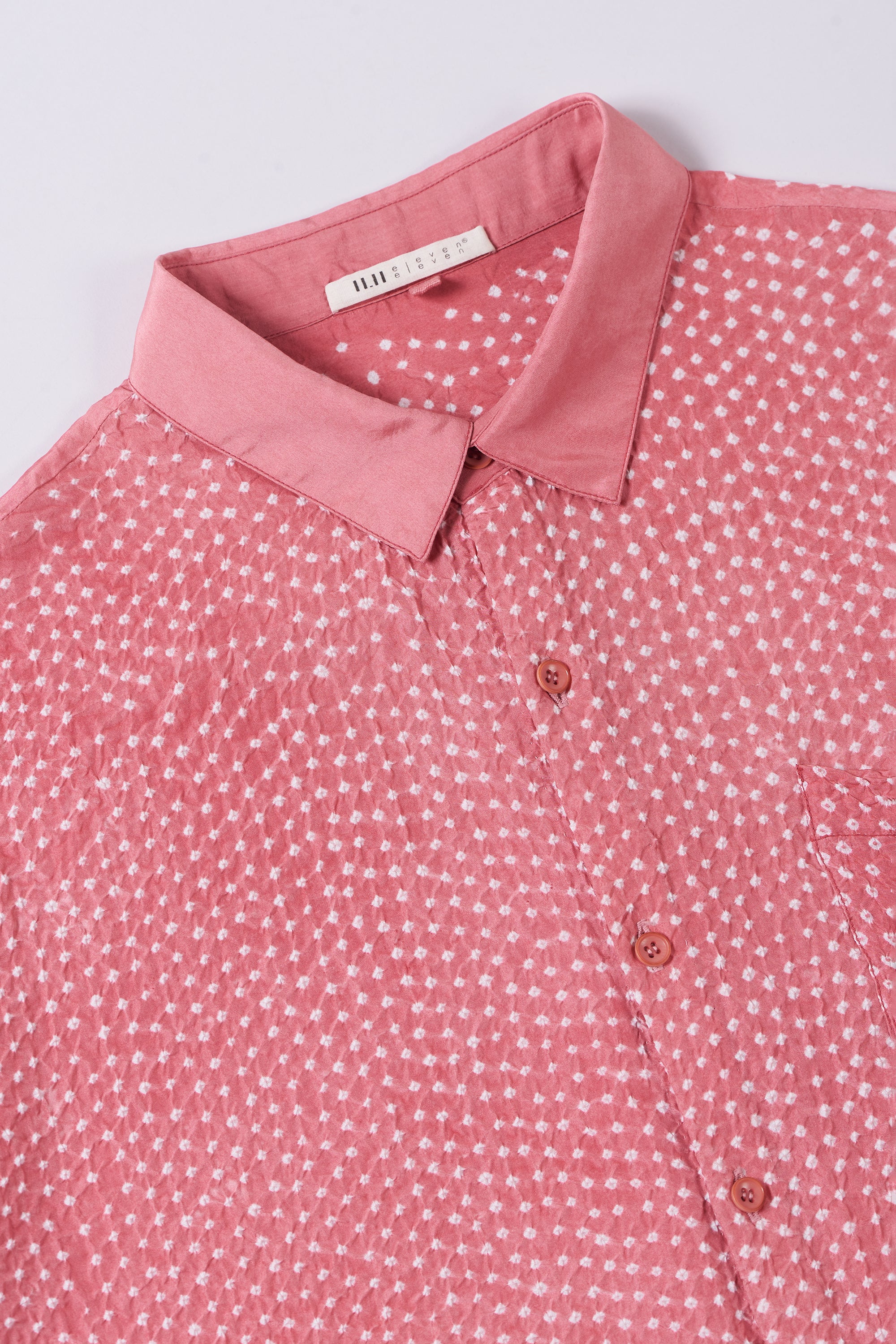 Close-up of a fabric with buttons and collar