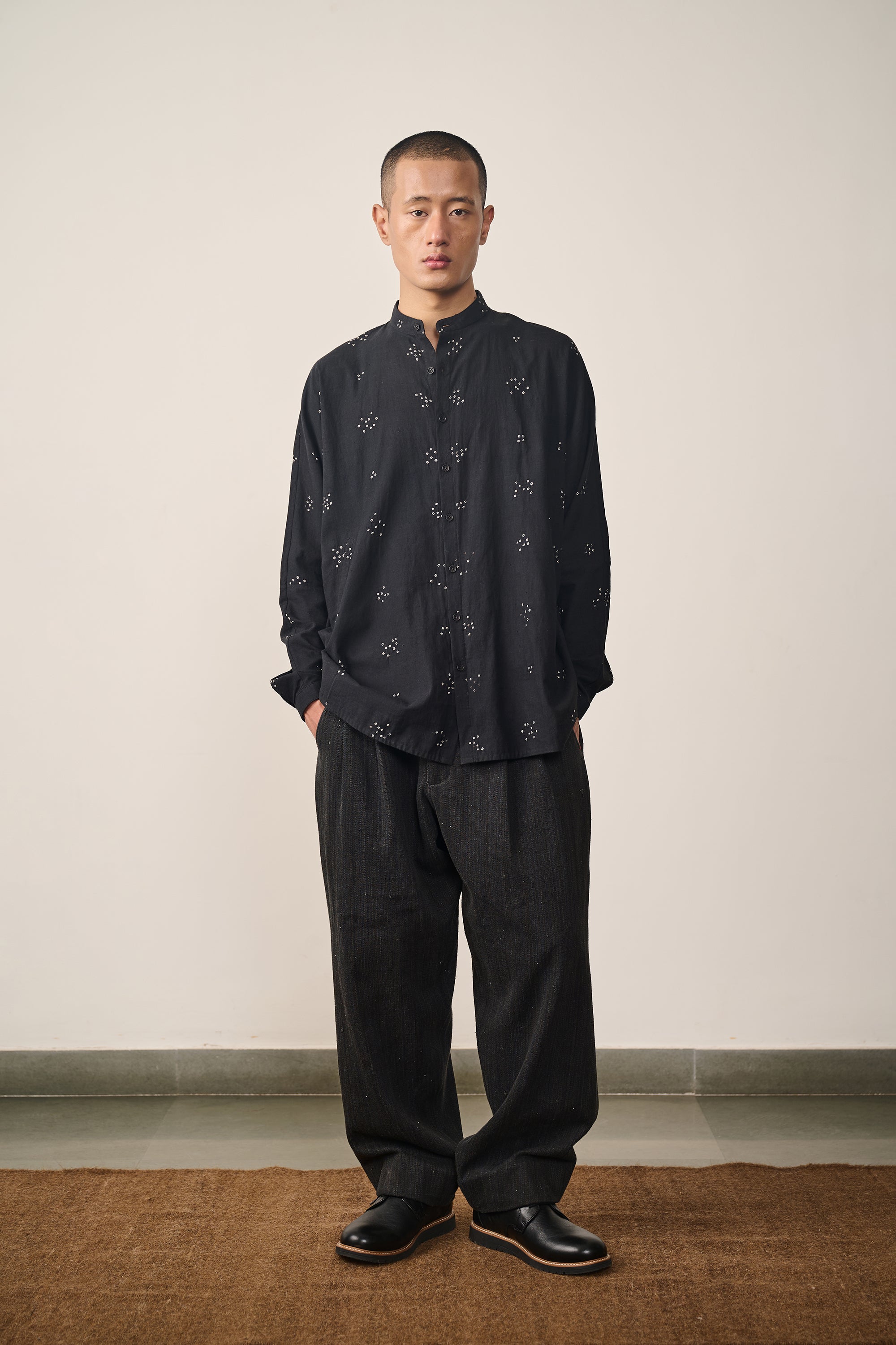 A man wearing cotton black bandhani shirt