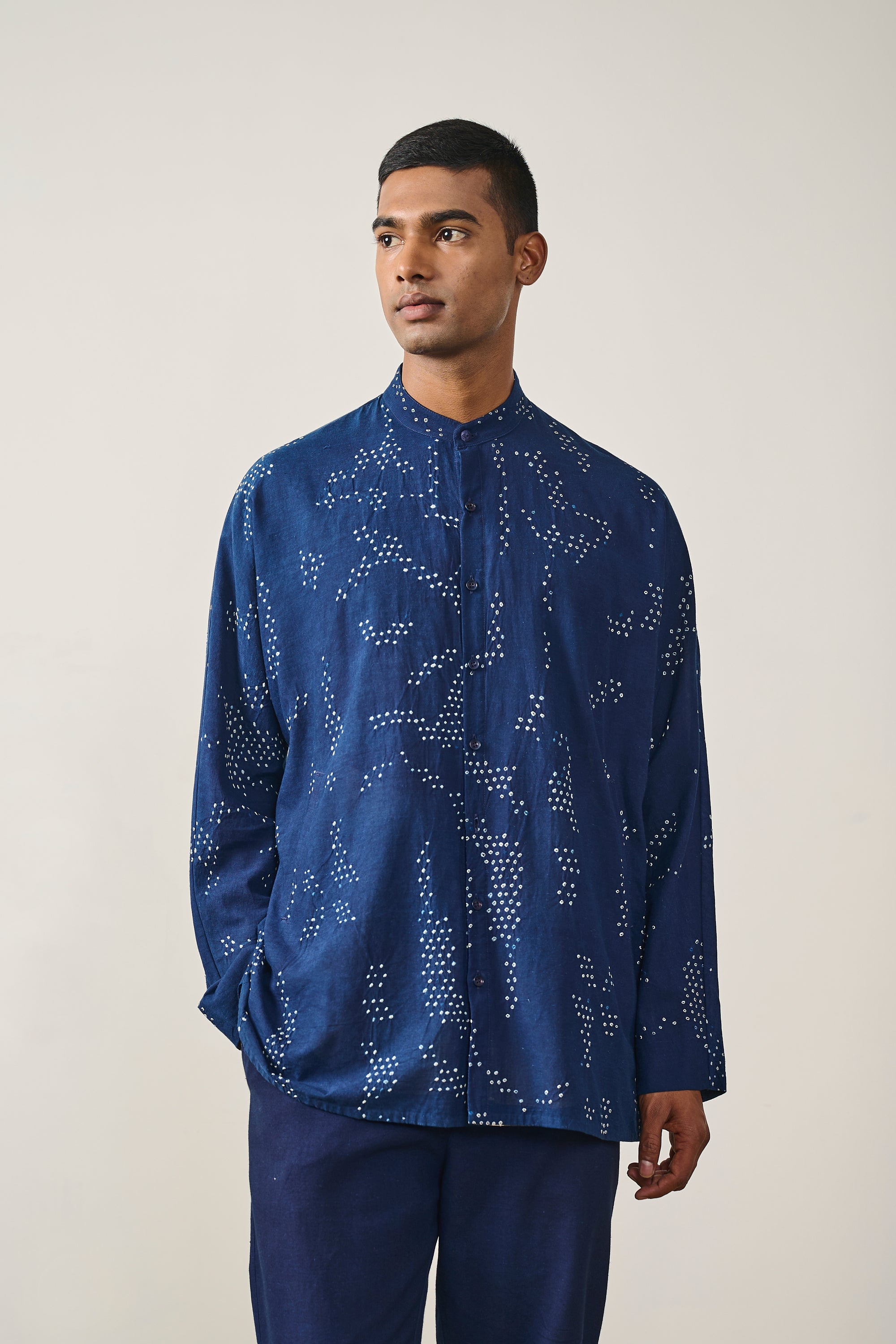A man wearing indigo cotton shirt