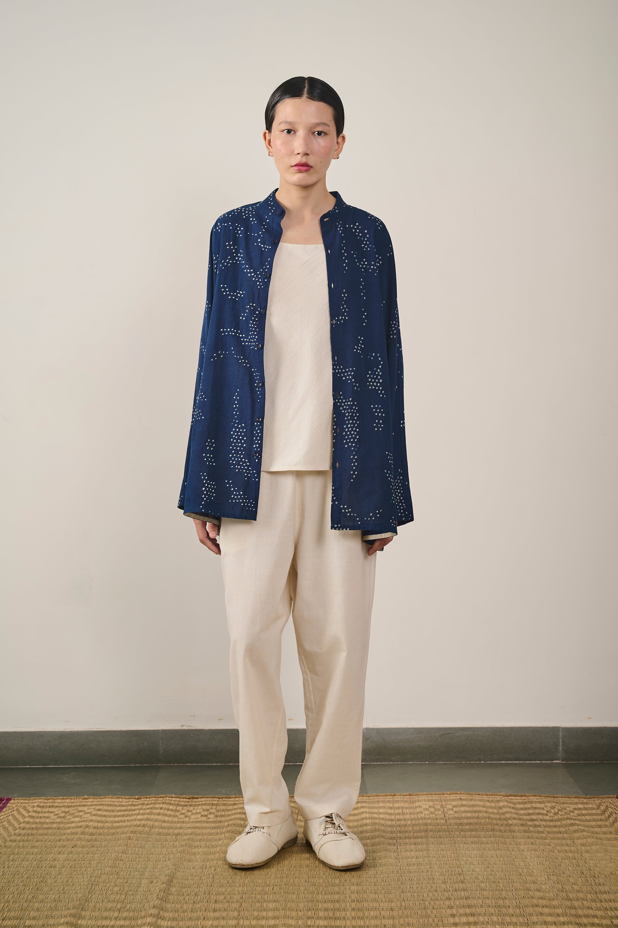 A woman wearing indigo cotton shirt