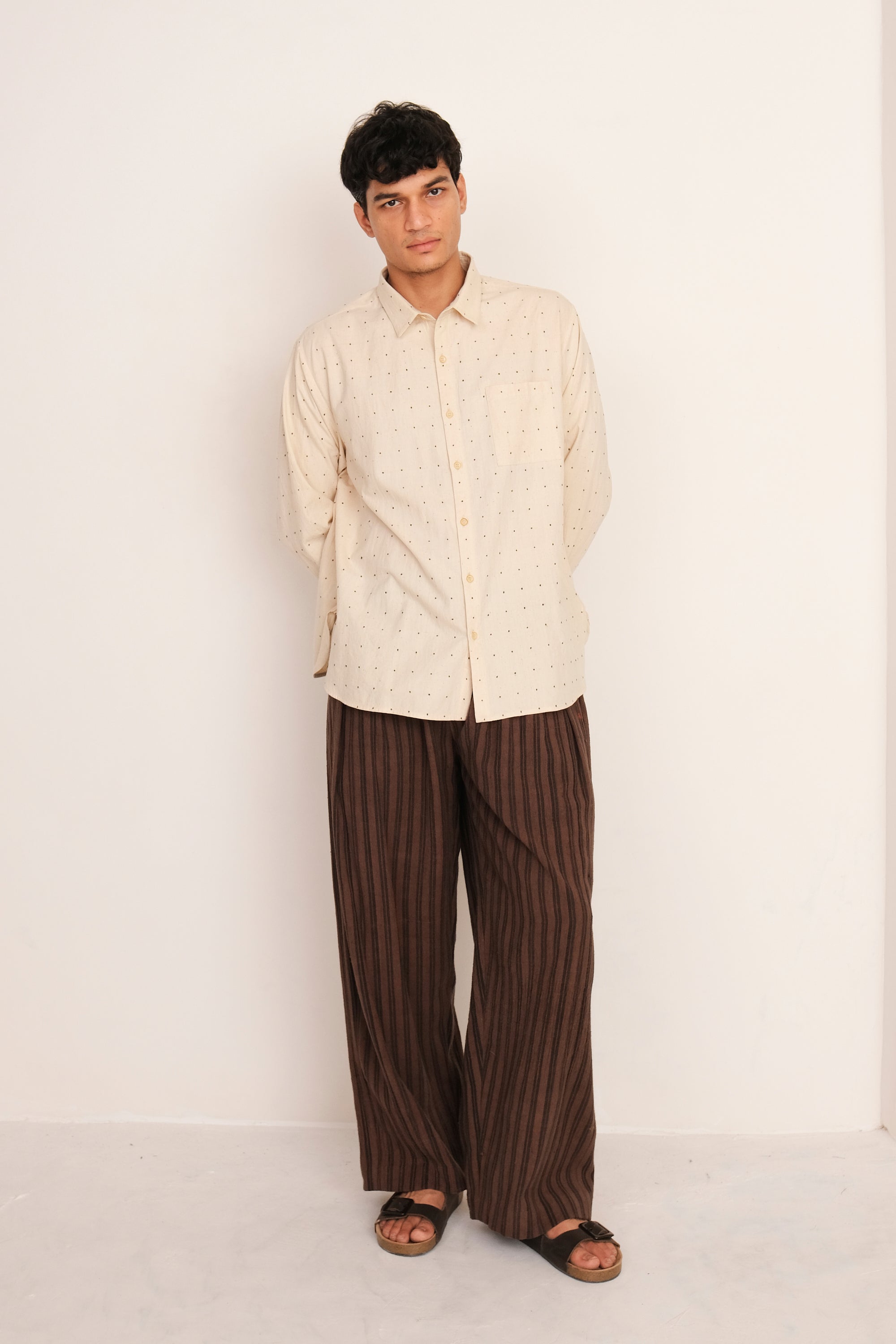A man wearing ecru cotton tangaliya shirt