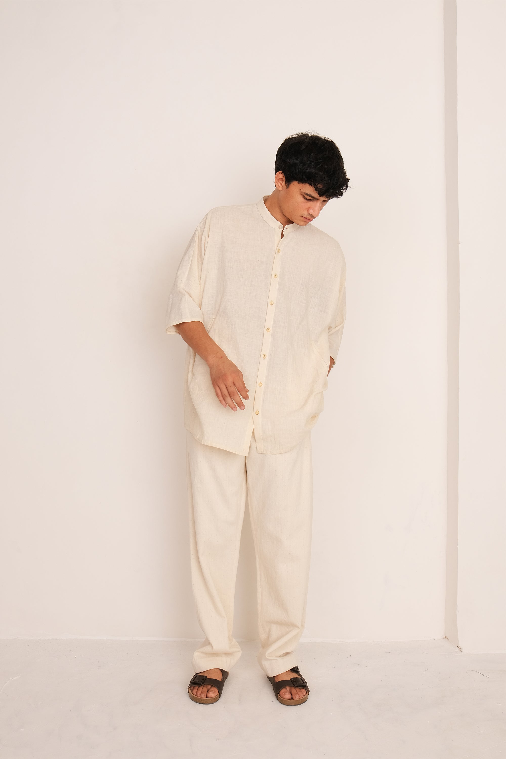 A man wearing ecru cotton shirt