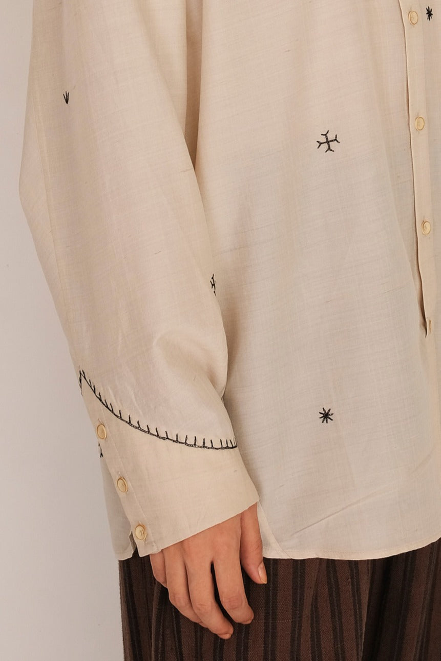 Fabric close-up with sleeves and hand embroidery