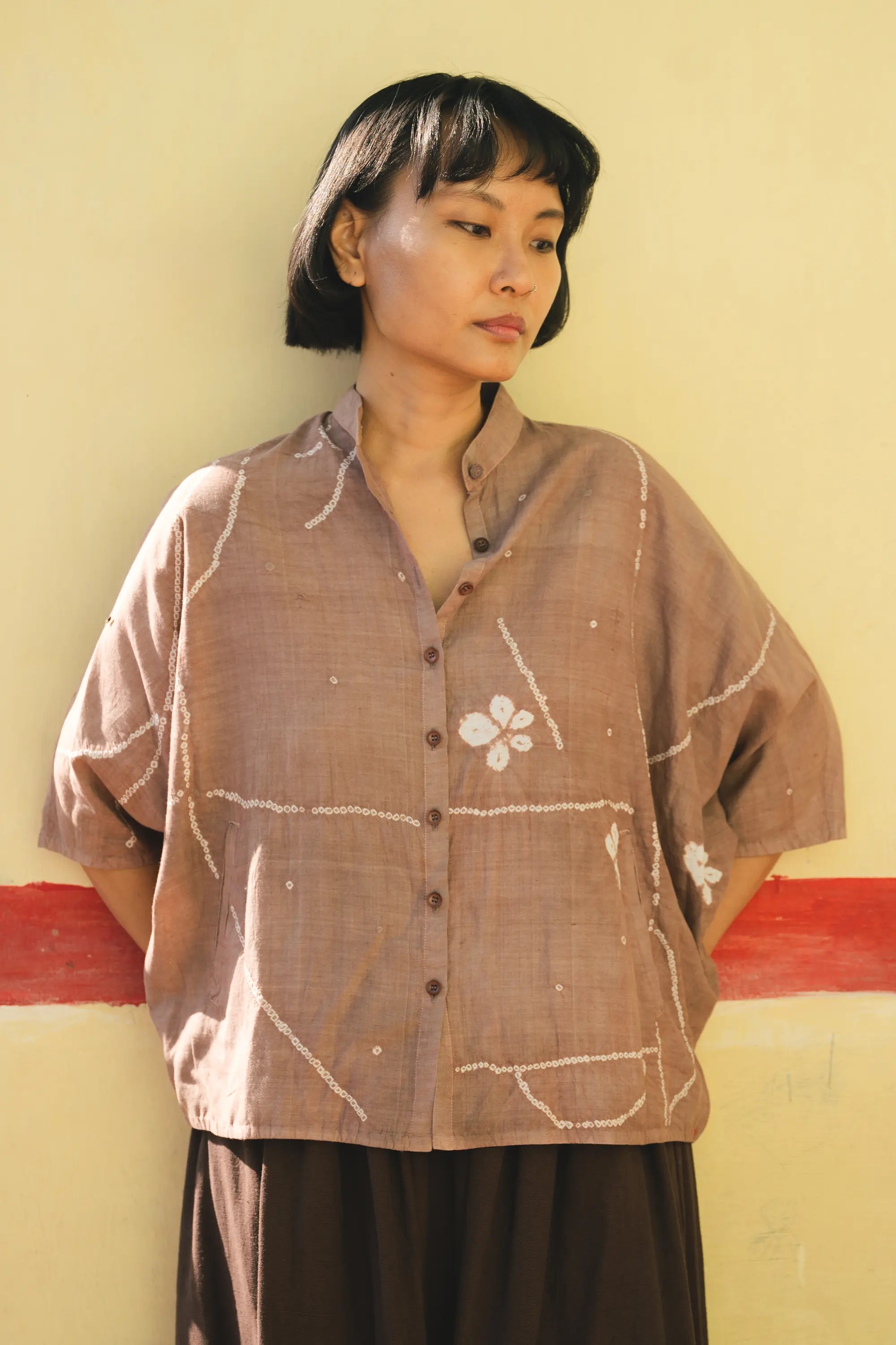 A women wearing burnt umber cotton silk shirt