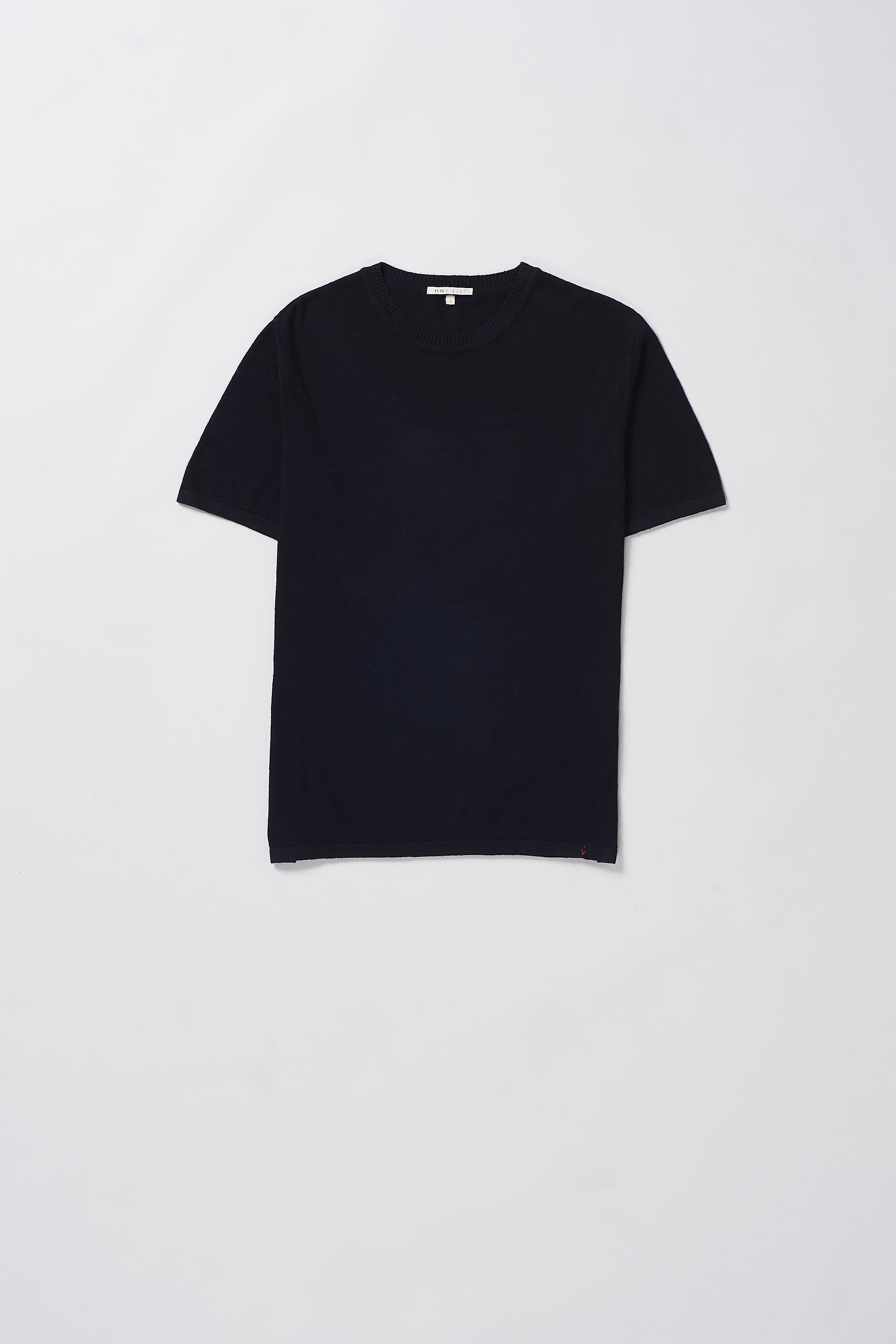 Black t-shirt on a grey background
