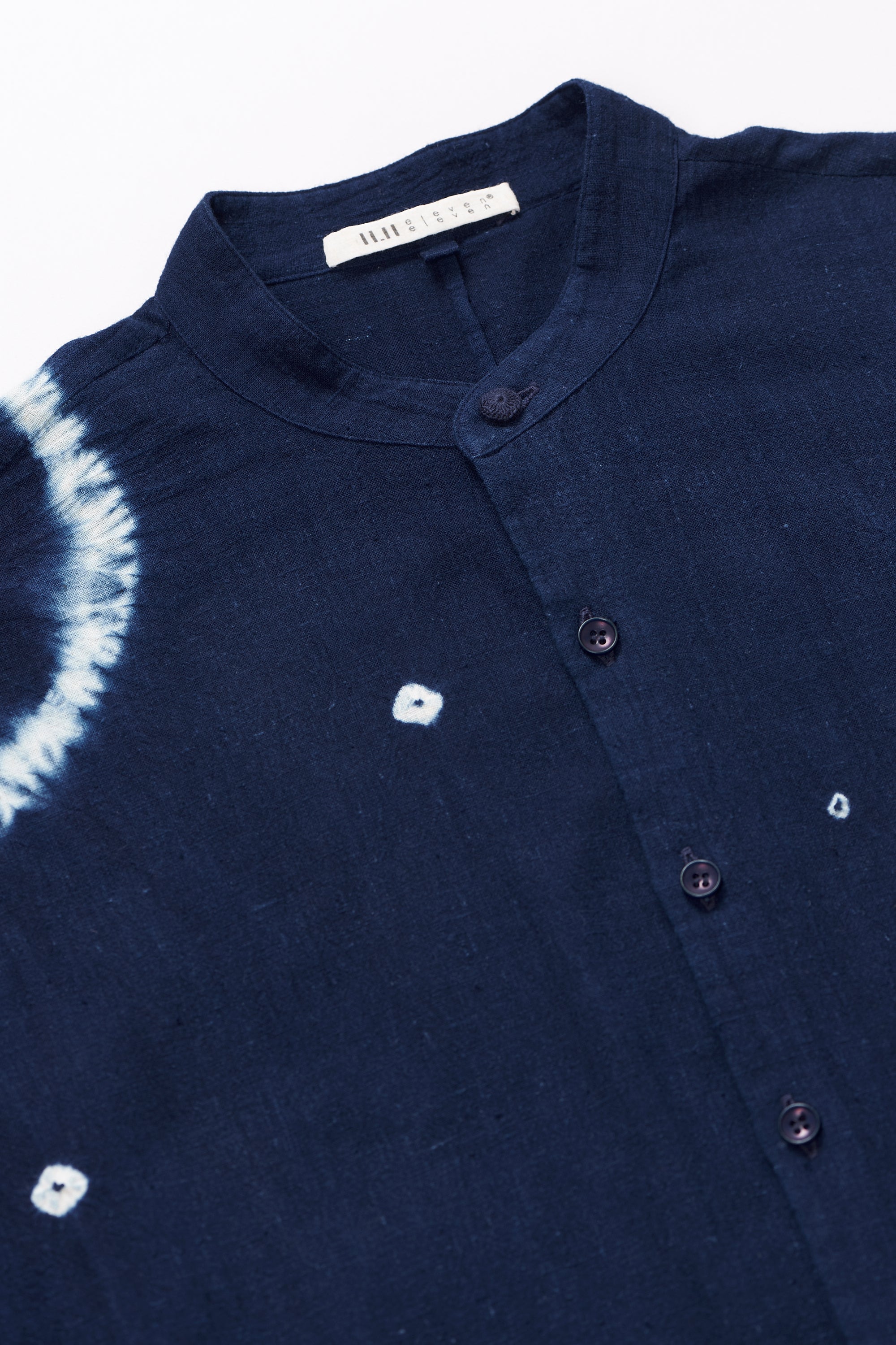 Fabric close-up with buttons with shibori