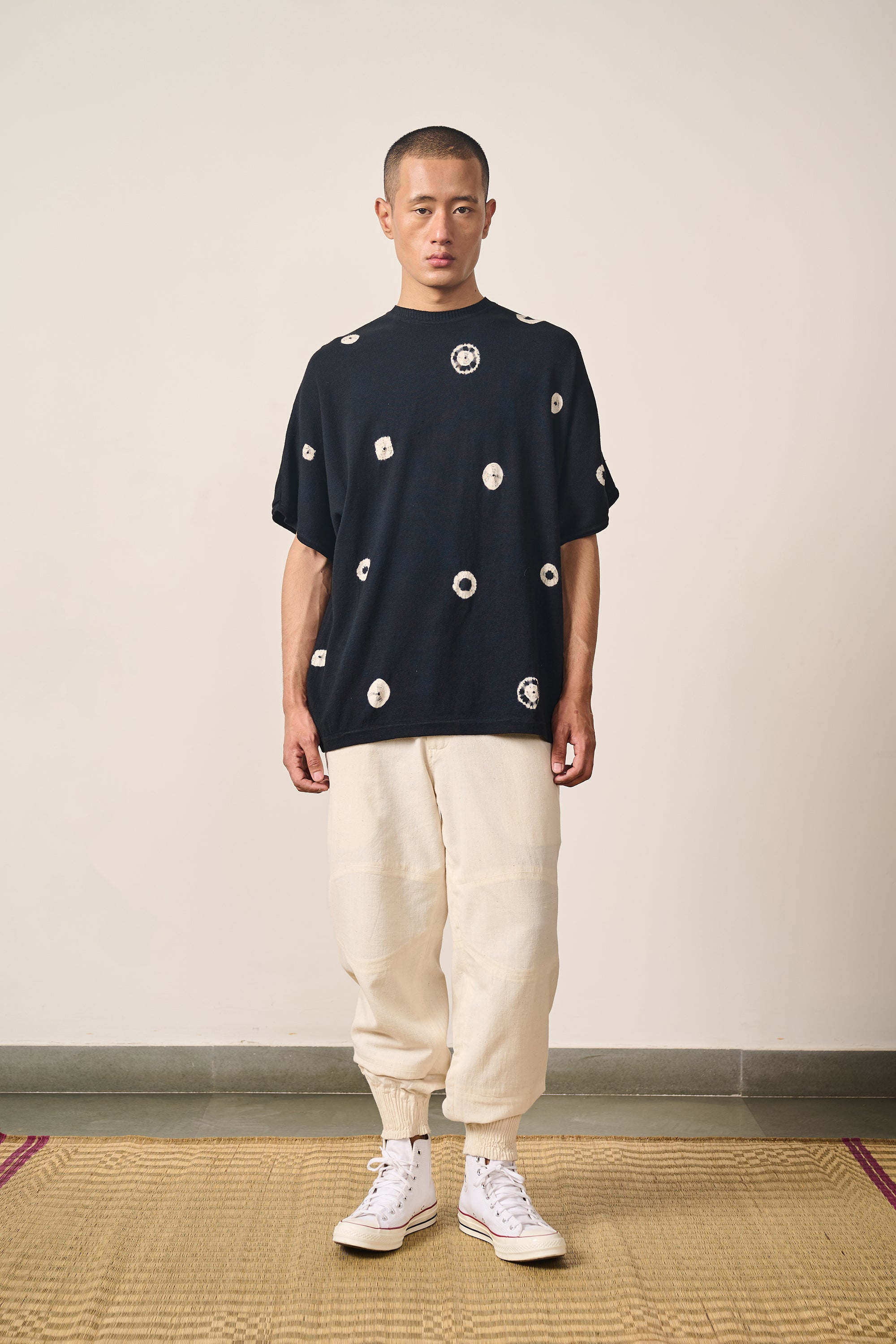 A man wearing black shibori t-shirt