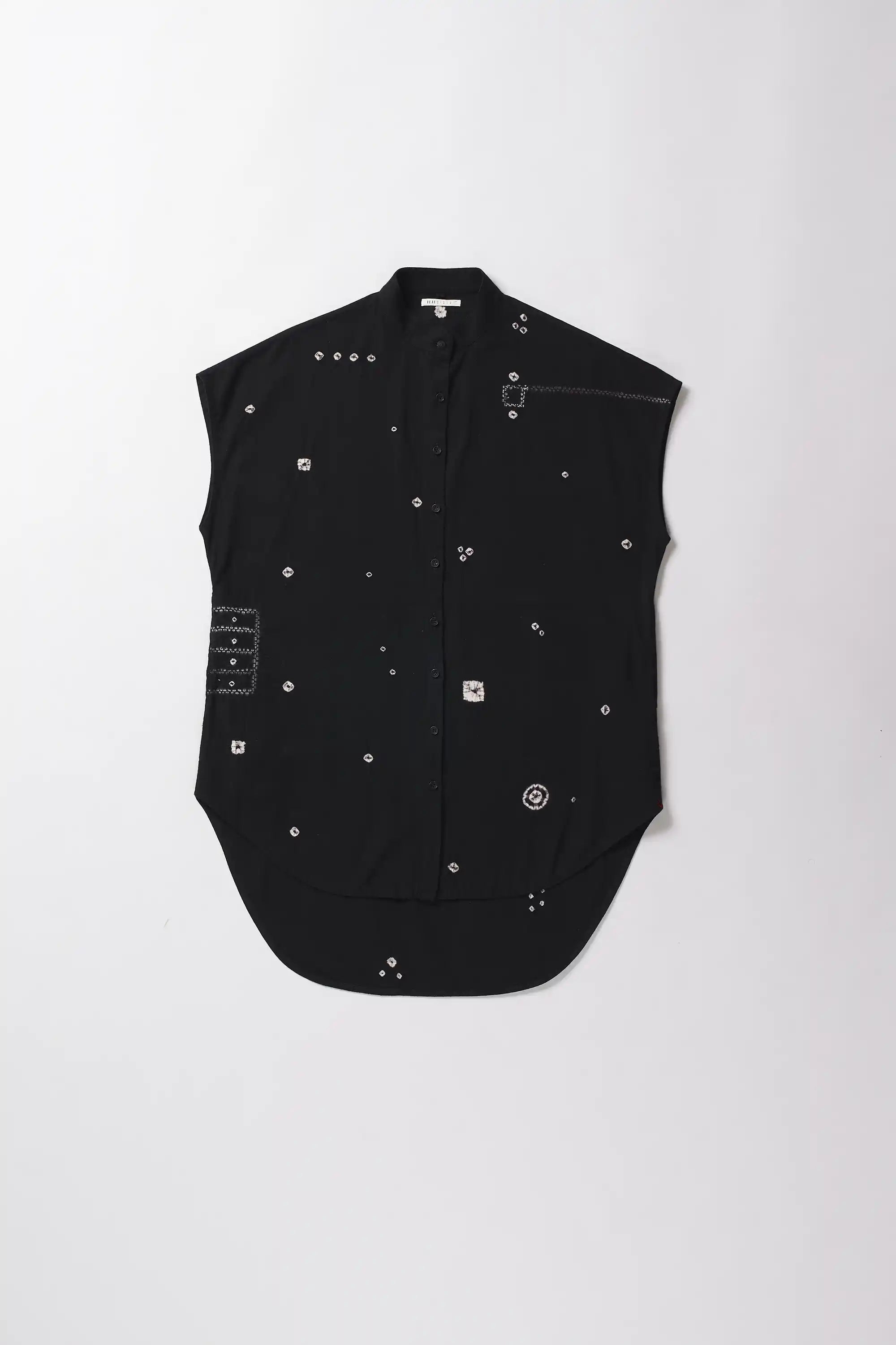 Black sleeveless shirt with decorative elements on a white background
