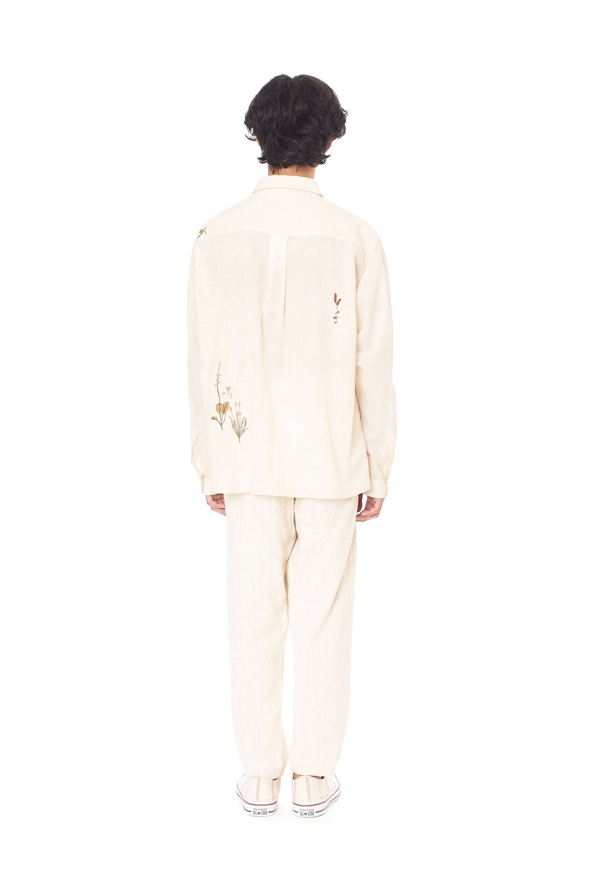 A back shot of a man wearing cotton shirt