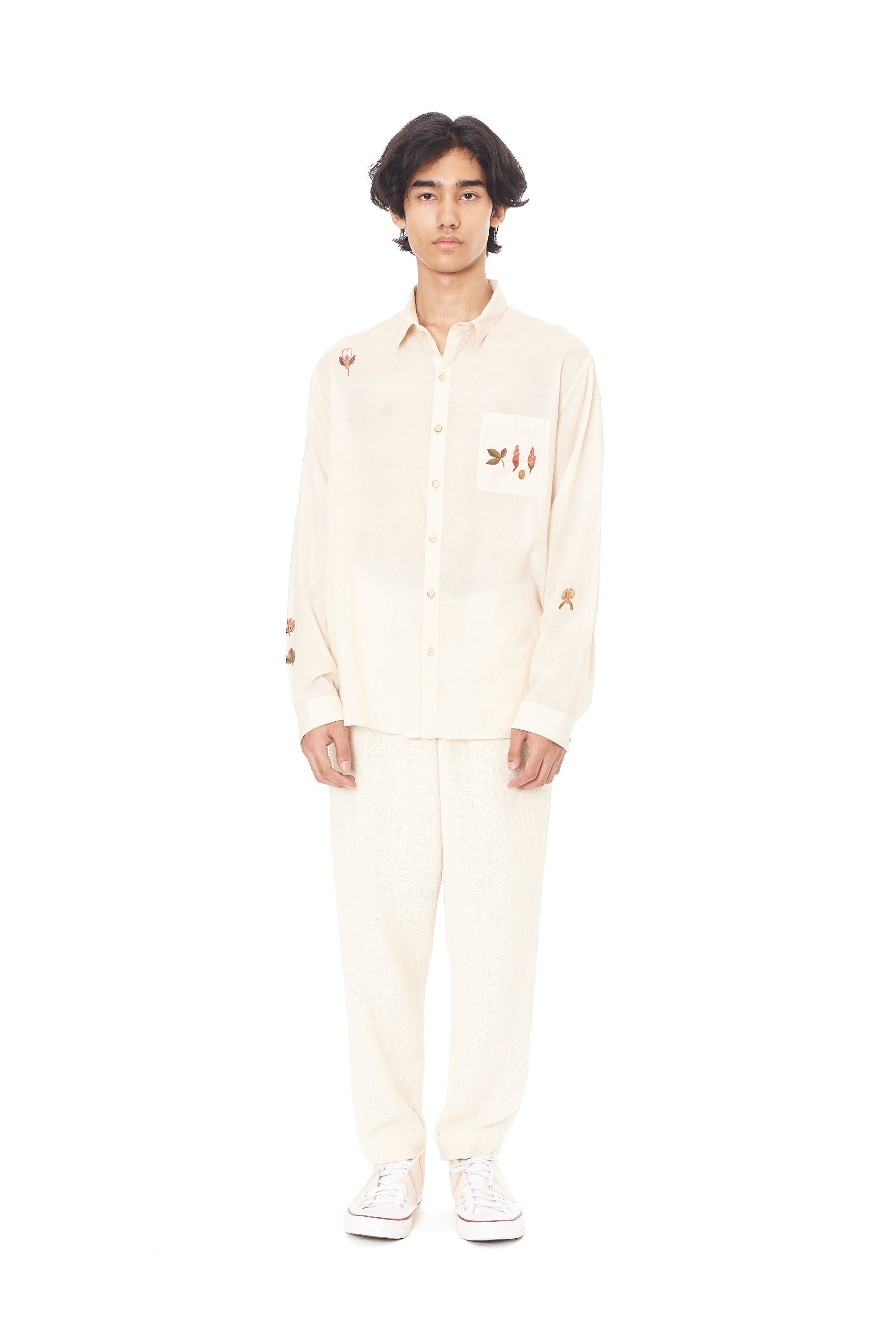 A man wearing ecru cotton shirt