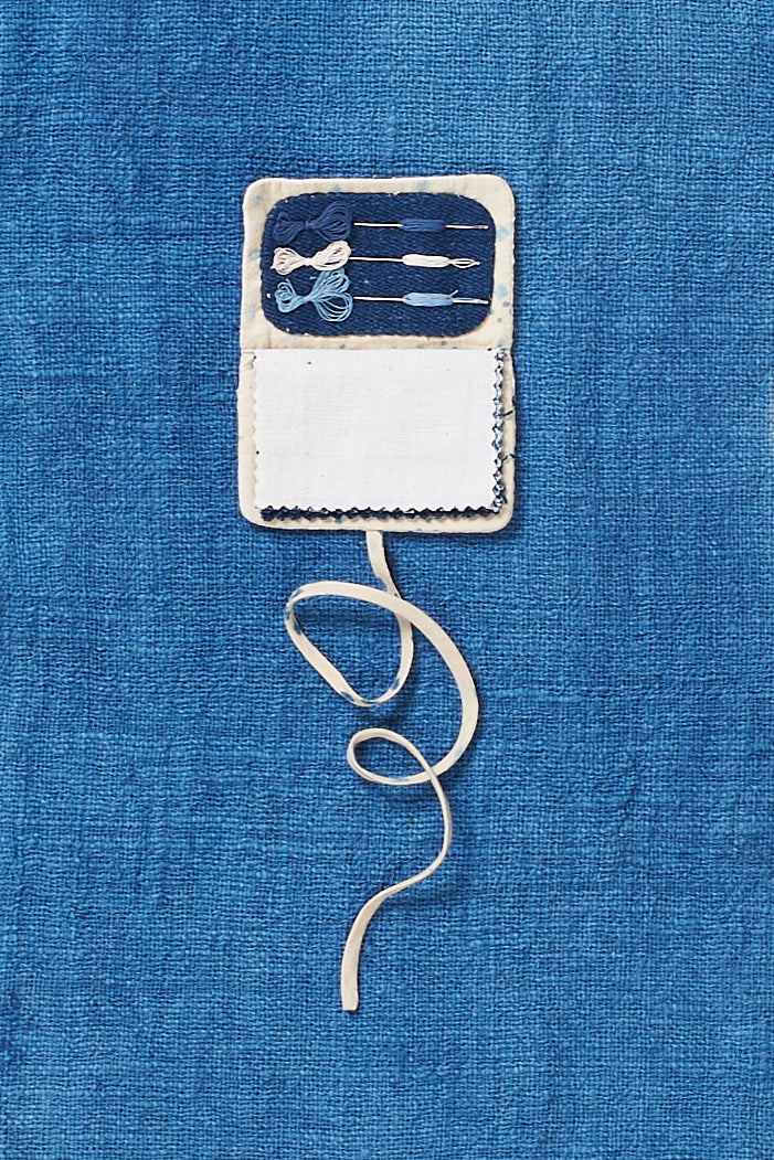Open ecru sewing kit