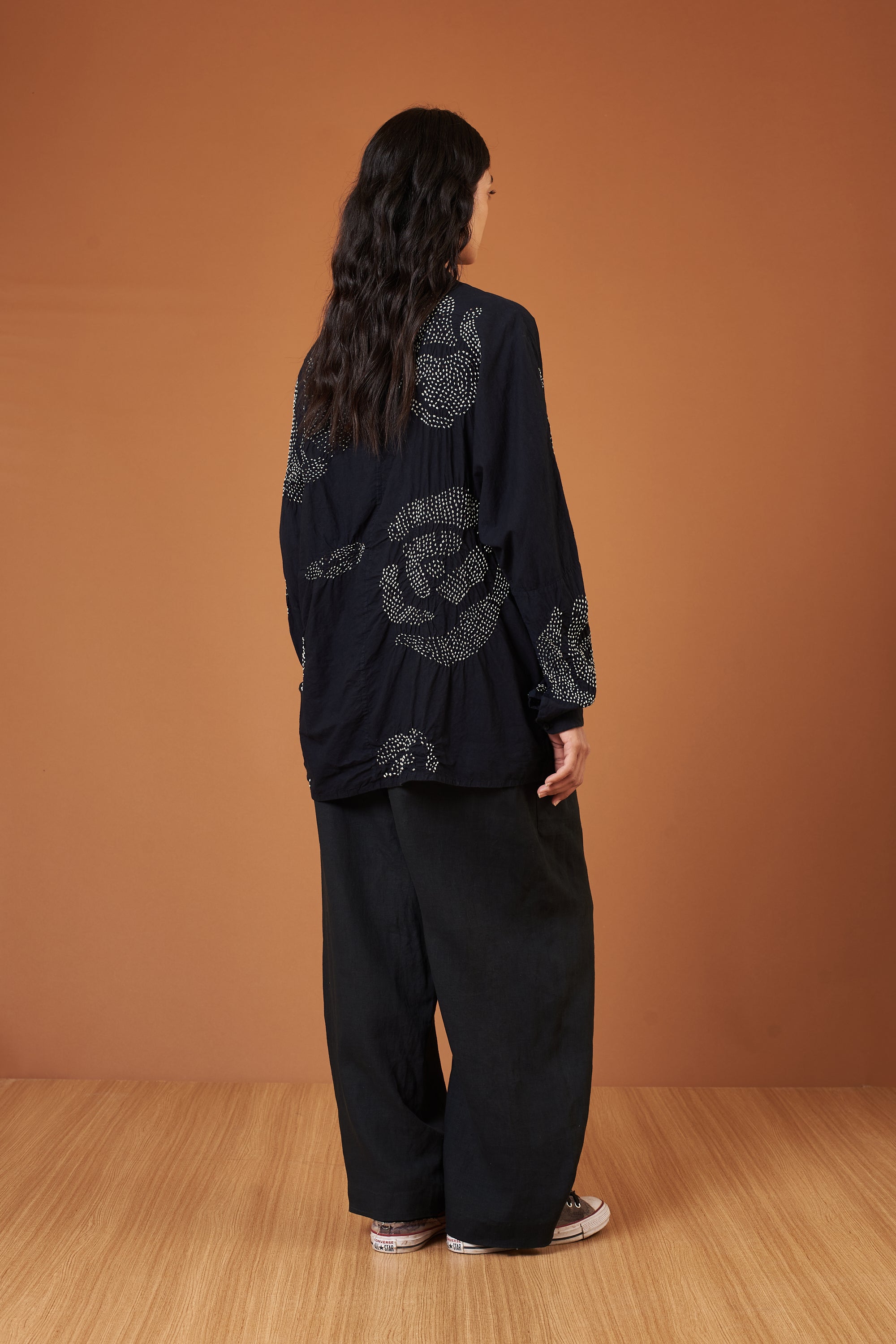 A back shot of a woman wearing black shirt