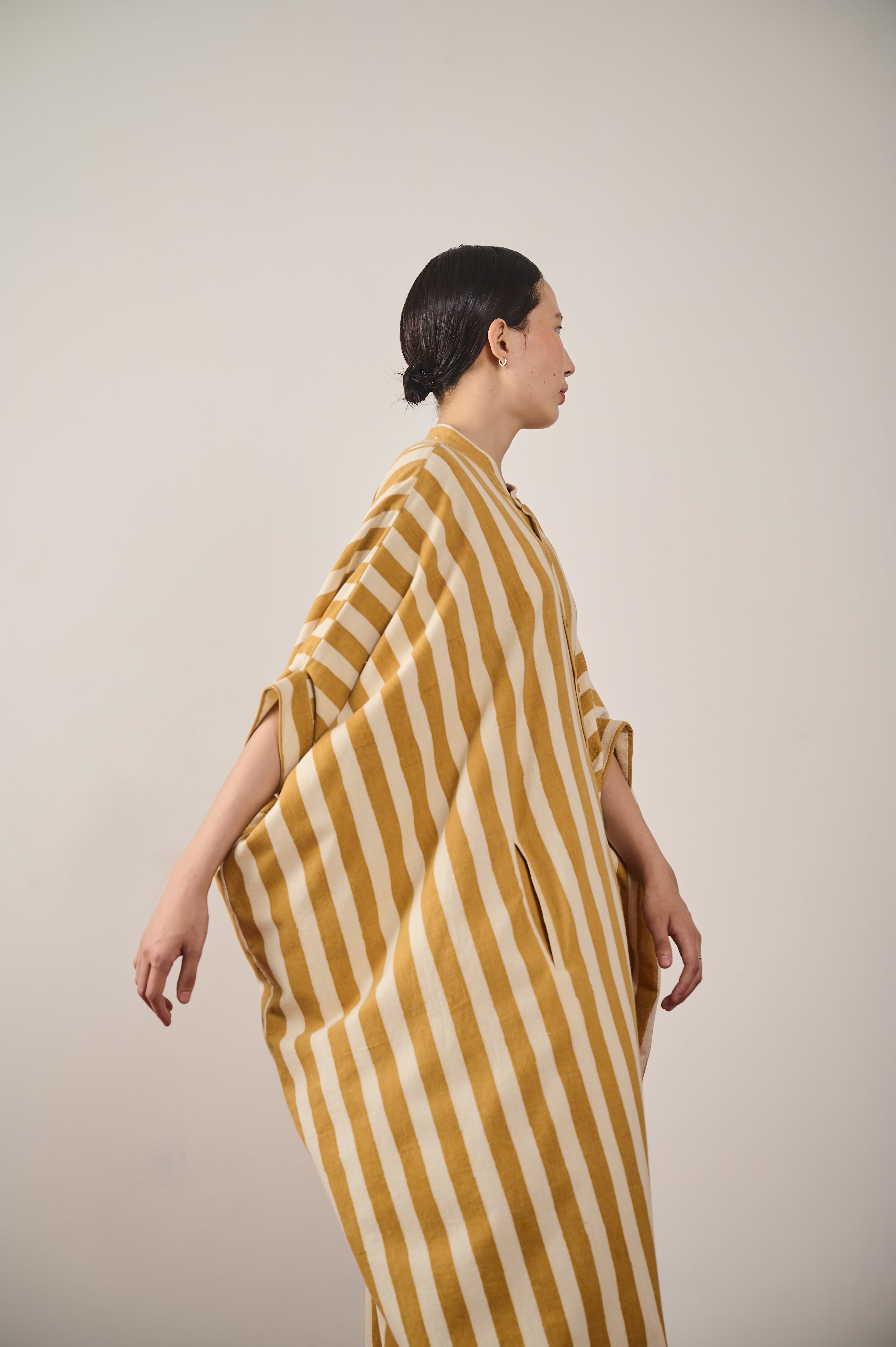 A side shot of a woman wearing cotton kaftan