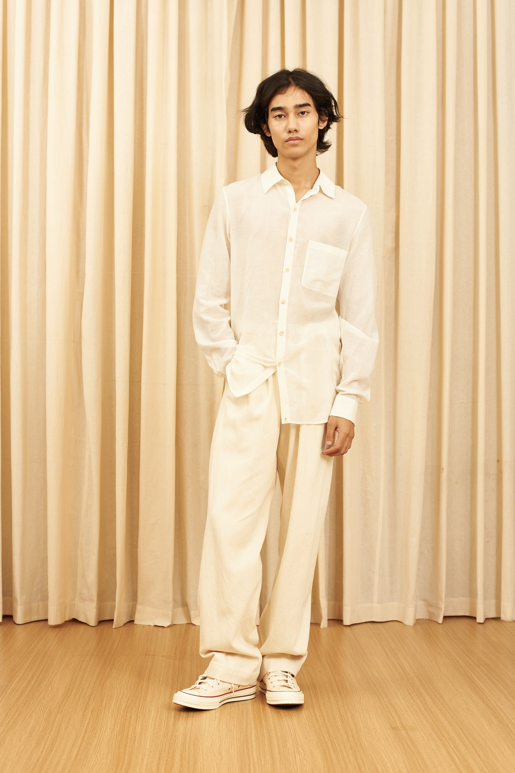 A man wearing ecru shirt