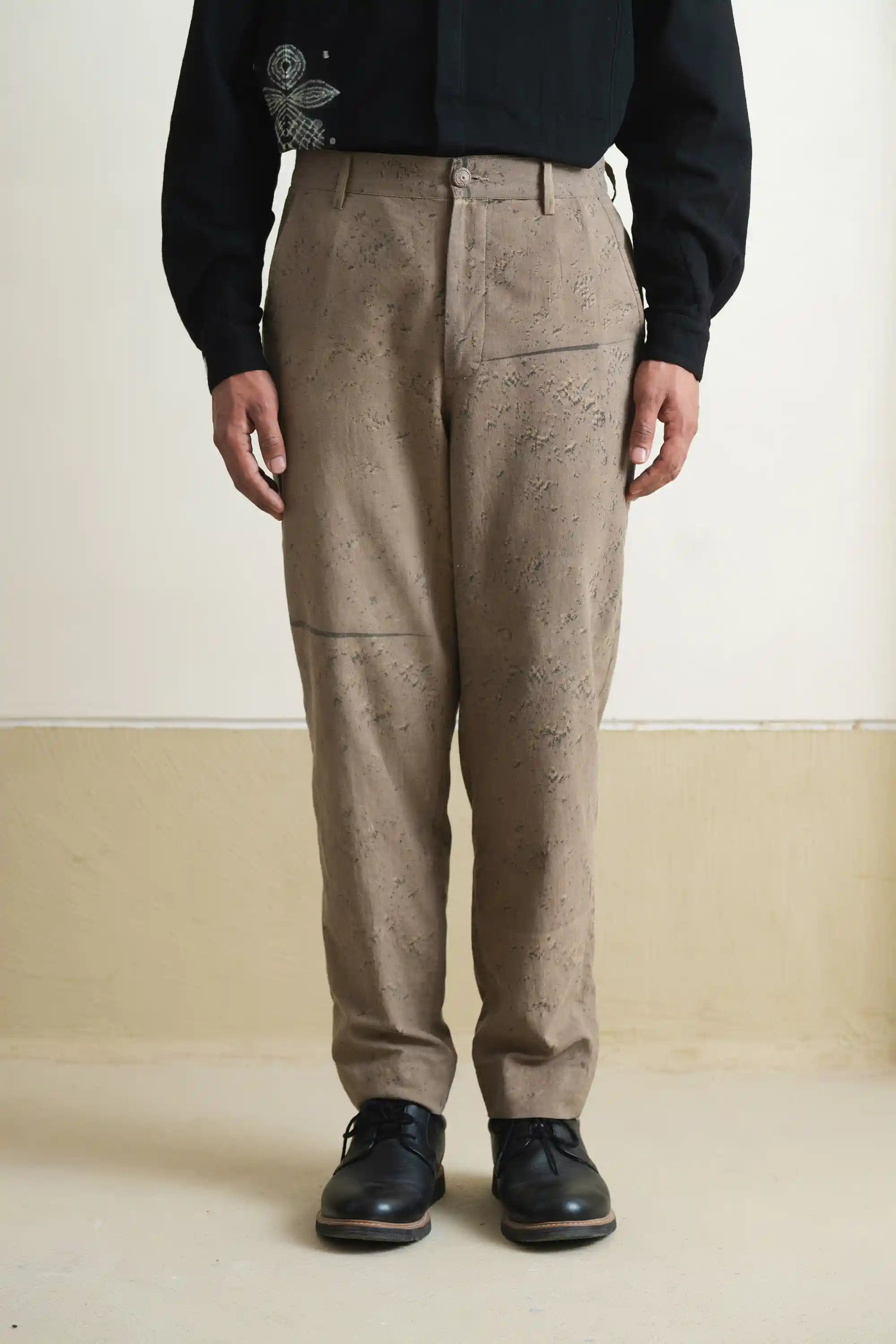 A man wearing khaki green cotton pant