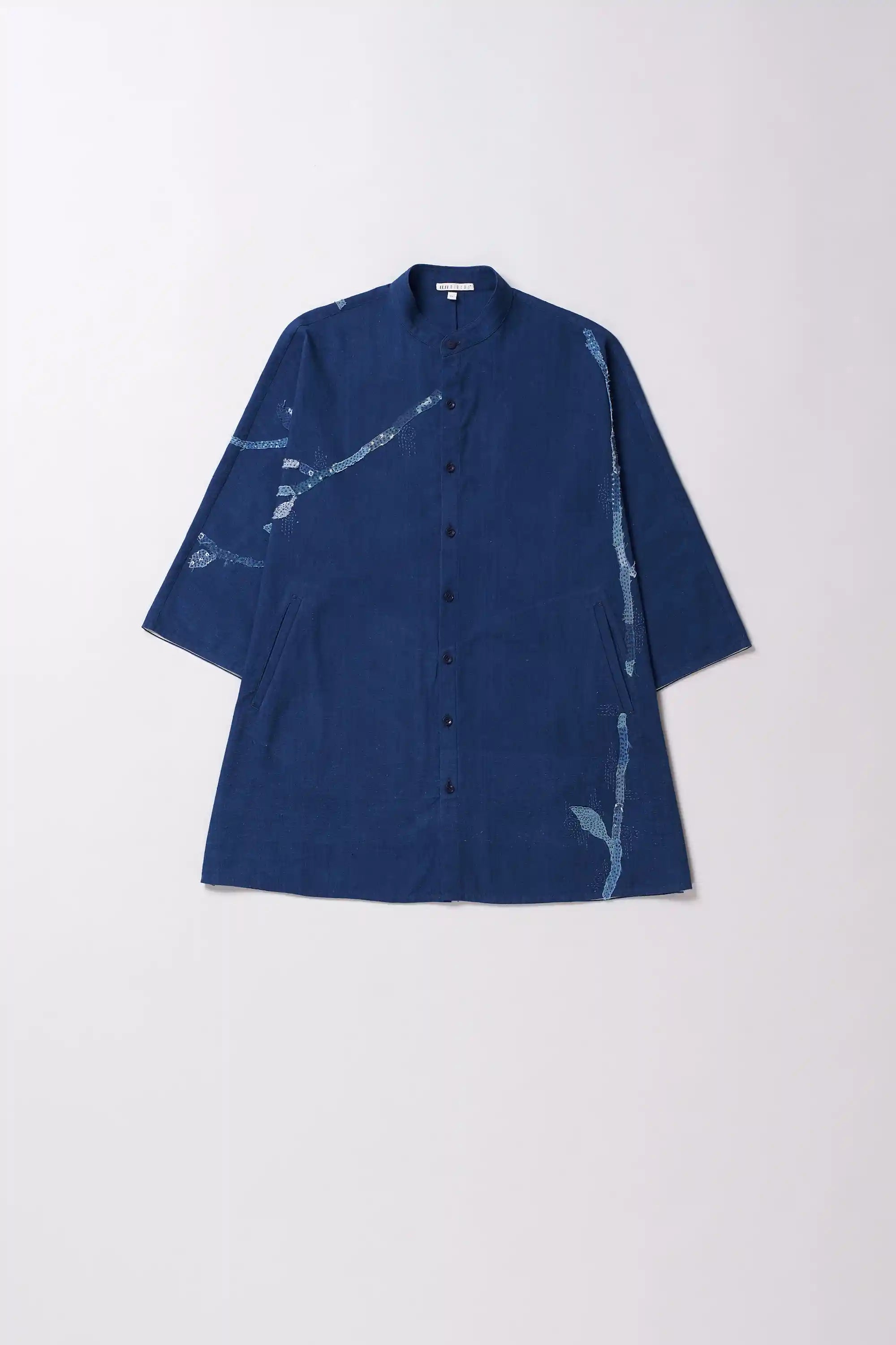 Blue shirt with white patterns on a white background