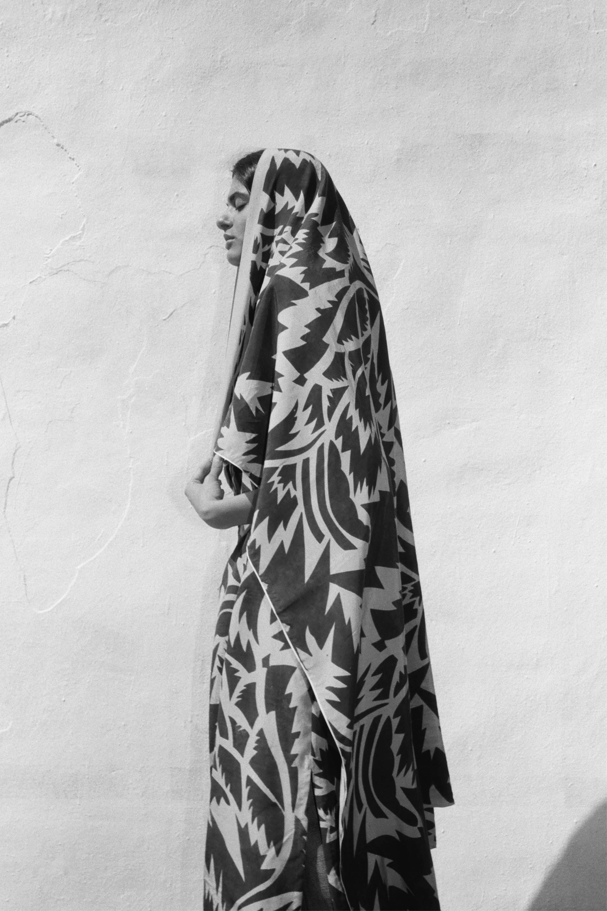 A woman wearing silk scarf
